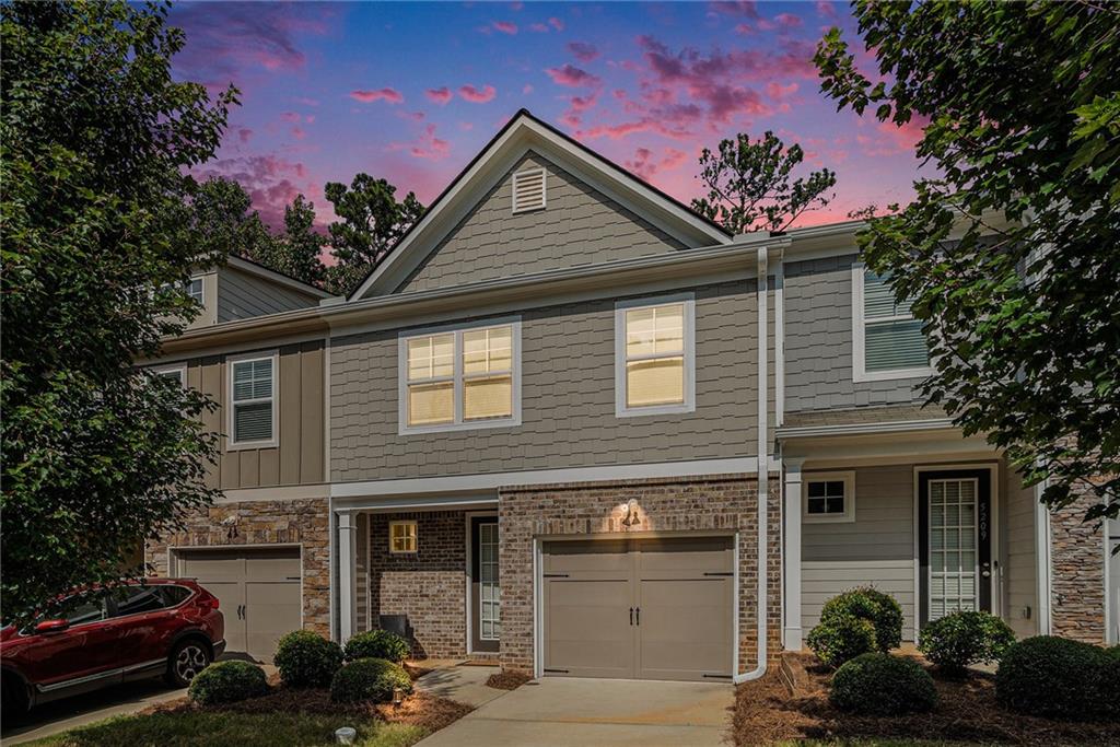 Welcome to this move-in ready newer townhouse featuring modern finishes and sought out open concept layout. Enjoy cooking and entertaining from the kitchen with granite countertops, white shaker cabinets, a large island, and eating area with views of the private backyard. The family room is inviting with a fireplace, ideal for relaxing or hosting guests.
Upstairs, you'll find an oversized owner's suite with ensuite bath that includes double vanities. A walk-in closet seals the deal. Two additional generously sized bedrooms share a full hall bathroom, perfect for family or guests. The laundry closet is conveniently with the bedrooms and the full-size washer and dryer is included.
Outside, the private backyard offers a blank canvas ready for your personal touch—whether it's a garden, patio, or play area. The home also features a one-car garage, an extra parking spot in the driveway, and guest parking nearby. Located in a secure, gated community, this home combines comfort, convenience, and peace of mind.
