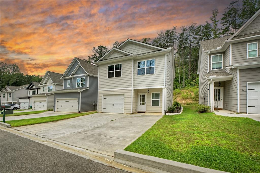 WELCOME HOME to this amazing home nestled in the quiet, FAMILY-FRIENDLY COMMUNITY of Hood Park Villas. This beautiful 3-bedroom, 2.5 bath, 1,792 square foot home blends comfort, style, and convenience in a growing neighborhood. The inviting layout begins with a one-car garage that opens into the spacious open-concept living, dining, and kitchen area featuring durable LVP flooring, granite countertops, tall ceilings, a kitchen island, pantry, stainless steel appliances, and soft-close cabinetry. A convenient half bath with pedestal sink is also located on the main level, along with sliding glass doors that lead to a private patio for outdoor enjoyment. Upstairs offers three bedrooms, two full baths, and a hallway laundry area. Step into the DREAMY and OVERSIZED PRIMARY BEDROOM with his-and-her closets and an ensuite bath with a large granite counter and a tub/shower combo. Enjoy two additional bedrooms and a full bath with granite vanity complete the upper level. Nestled in the quiet, FAMILY-FRIENDLY community of Hood Park Villas, this home blends comfort, style, and convenience in a growing neighborhood perfectly located just minutes from downtown Jasper, Hwy 515, Publix, shopping, and more. Don't miss the opportunity to make this your next dream home!