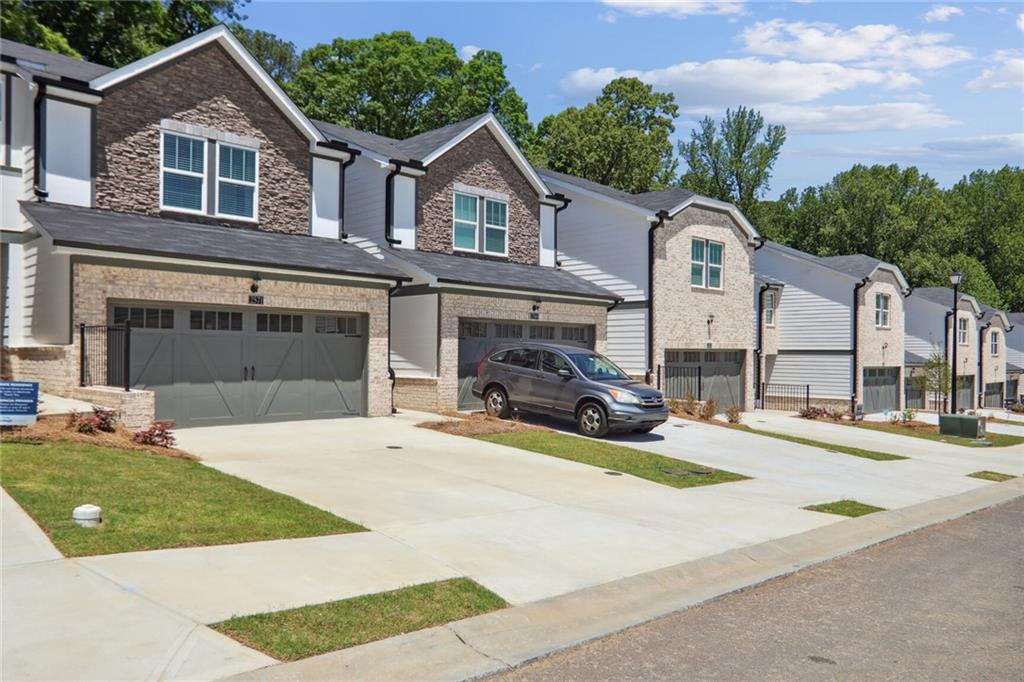 ***MOVE IN READY*** BRAND NEW***NEVER OCCUPIED*** Spacious, Airy, & Light filled up 3 bedrooms & 2.5 bathroom OPEN FLOOR PLAN Energy-Efficient Townhome w/ Carriage Style 2 car garage. COVERED BACK PATIO & PRIVATE BACKYARD is great for entertaining & relaxation. Luxury Wood-Look EVP Floors throughout on MAIN LEVEL, Master BA, 2nd BA, & Laundry Room. Kitchen features 42" Cabinets, Backsplash, Quartz C-Tops, Island, Walk-In Pantry, Stainless Steel Appliances. Master bedroom w/ walk in closet & Master bathroom w/ double vanities, quartz countertop, & spacious shower. 2nd BA w/ quartz counter top, & tub. Lots of visitor parking spaces near the house. NEW Washer, Dryer, & stainless steel side by side Refrigerator will stay. Lawn Maintenance is included in rent. Energy-efficient home-multispeed HVAC system, spray form insulation, high-performance air filtration, LED lightings as well as tankless water heater. Easy access to shopping and dining. Minutes to Downtown Snellville & The Shoppes at Webb Gin. NO PETS & NO SMOKING. Prefer a long term tenant who can sign Min 2 years Lease. A MUST SEE!
