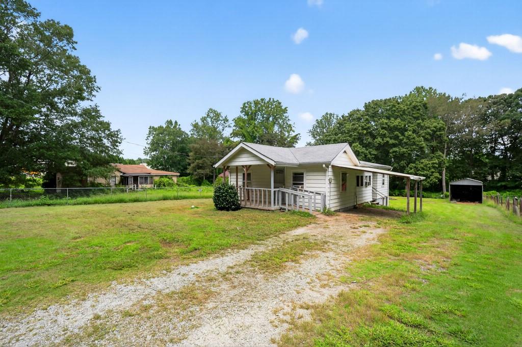 Discover this attractively priced investment opportunity in Union City, just 20 minutes from downtown Atlanta. This single-family home offers strong fundamentals with a sturdy 7-year-old roof, plus a barn, storage shed, and carport that add versatility and value. Requiring only cosmetic updates, it’s an ideal flip or rental project with high-return potential. Modernizing the kitchen with updated cabinetry, countertops, and appliances, refreshing the bathroom with new fixtures and tile, and applying fresh interior and exterior paint will quickly maximize appeal. Optional upgrades like hardwood floors, a new HVAC system, and minor landscaping can further boost value, while improvements to the barn and shed enhance curb appeal. Close to shopping, dining at Shannon Mall, and outdoor recreation at Ronald Bridges Park, this property is perfectly positioned for appreciation and rental income in Union City’s thriving market. This is the perfect opportunity for investors seeking a straightforward renovation with excellent upside potential in a growing community.