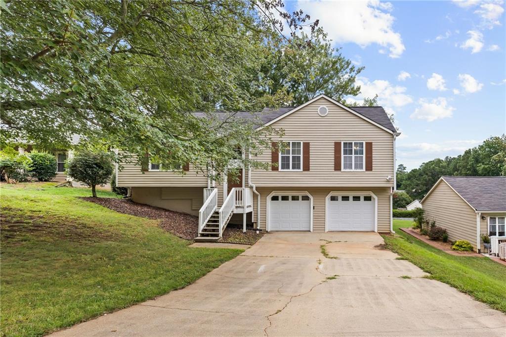 Welcome to 220 Magnolia Tree Ct - a home where comfort meets convenience in the sought-after Morton Plantation subdivision of Alpharetta! From the moment you arrive, you'll feel the charm of a quiet, established neighborhood perfectly positioned near all the best North Fulton has to offer. Step inside to a light-filled layout that invites both relaxation and connection. The spacious living room, anchored by rich hardwood floors and a cozy fireplace, is ready for movie nights or lively gatherings. The kitchen offers plenty of space to create memorable meals, while the dining area seamlessly flows for easy entertaining. Upstairs, the bedrooms provide peaceful retreats, and the primary suite offers the privacy you deserve. Downstairs, the additional living space can flex as a home office, media room, or guest quarters-giving you the versatility you've been looking for. Outside, enjoy the perfect balance of low-maintenance living and space to play, all just minutes from Avalon, Downtown Alpharetta, and top-rated schools. Morton Plantation residents love the mature tree-lined streets, the friendly community atmosphere, and the unbeatable location with quick access to GA-400, parks, shopping, and dining.