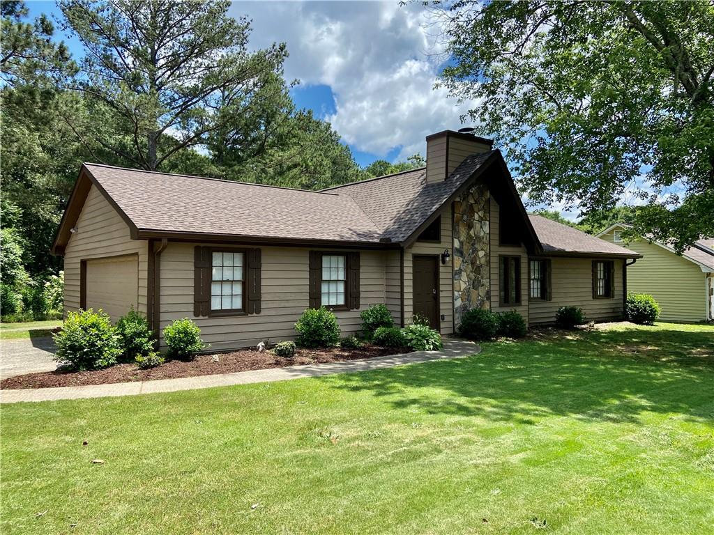Great ranch style home in desirable Grayson location with no HOA! This home features an inviting living room with floor to ceiling stone fireplace. The main living areas have been updated with new laminate flooring. The spacious eat in kitchen has plenty of cabinet space, vaulted ceilings and a bay window for lots of natural sunlight! There is a large laundry room which is perfect for extra storage! Down the hallway there is a full bathroom, two secondary bedrooms, and the primary bedroom with bathroom! The primary bedroom has a spacious closet and ensuite with shower. If you are looking for an amazing home on a great lot in a quiet neighborhood in Grayson, this is the one for you!