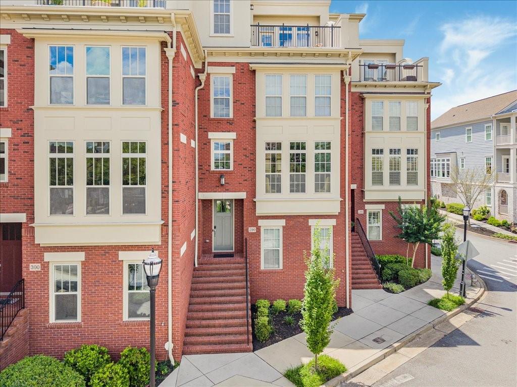 Live at the heart of it all just minutes from Marietta Square! Discover elevated townhome living in this show-stopping 4-level beauty, loaded with upgrades and unbeatable style! Welcome to this stunning 3 bedroom. 3 full and 2 half-bath townhome located just 0.1 mile from Marietta Square. This home offers the perfect blend of modern elegance, thoughtful design, and unbeatable location. Step inside to discover four spacious levels, featuring hardwood throughout and a neutral, move-in-ready palette. The main level boasts a formal dining room that flows seamlessly into an expansive chef’s kitchen-complete with quartz countertops, stainless steel appliances, a large center island with breakfast bar, and open views to the great room. Enjoy your cozy evenings by the fireplace, framed by custom built ins. The upper level offers a luxurious primary suite with a fully remodeled bath, and a generous secondary bedroom with its own ensuite bath. Ascend to the rooftop level, ideal for entertaining or relaxing, featuring wet bar, media room, and access to a grilling deck & private rooftop patio with a view of Marietta Square. The terrace level includes a third bedroom and full bath – perfect for guests or a private office-as well as access to the two-car garage. Additional highlights include: Four Sides brick construction, Elevator servicing all levels, Community Swimming Pool, Meticulously maintained and in pristine condition, Refrigerator Stays, as well as Murphy Bed, Washer & Dryer. This home offers luxury, convenience, and lifestyle in one incredible package. Schedule your private tour today and experience Marietta Living at it’s finest!