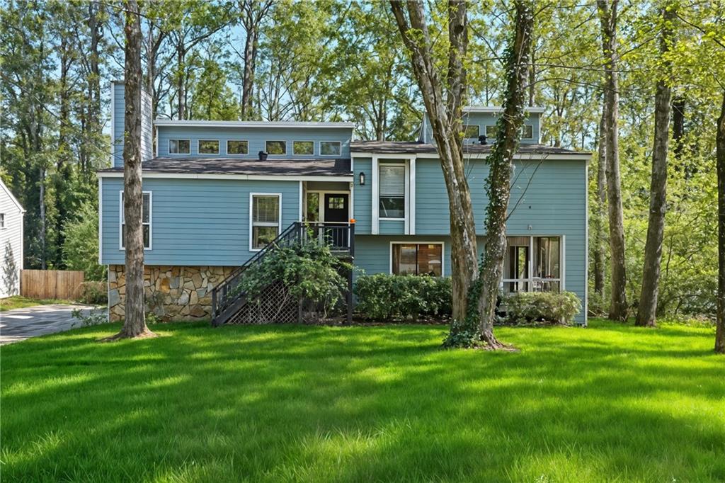Located in the desirable Pope High School district, you will find this updated and well maintained, 3 bed/2 bath home with a large basement. True pride of ownership as the seller has completely replaced all of the cedar siding with wonderful hardie-plank. Inside, you will find high ceilings, lvp flooring throughout the dining and living areas and all of the bedrooms. The charming cottage kitchen features refinished wood cabinets, bead board wainscoting, a 5 burner SS gas range, high ceilings, and lvp flooring. The master has an updated bathroom and beautiful stained-glass windows with soring ceilings. The two additional bedrooms upstairs share a bathroom with plenty of countertop space. All of the interior doors, including the front door, have been replaced. The water heater was replaced last year as well.
-----The large, open terrace level contains an office and is recently primed neutral, so you can paint it whatever color you would like. Two back decks (one is brand new) with built in seating and ample room for grilling or relaxing. The backyard has a firepit, perfect for fall weather, and is wooded and private. There is a great spot for basketball in the driveway, and the house sits at a cul-de-sac for extra parking. The neighborhood is transitioning and has a lot of upscale renovations going on throughout. Excellent location close to shopping, great schools, and many dining options. 15 min to DT Marietta or to DT Roswell, where some of the best night life and restaurants are located.