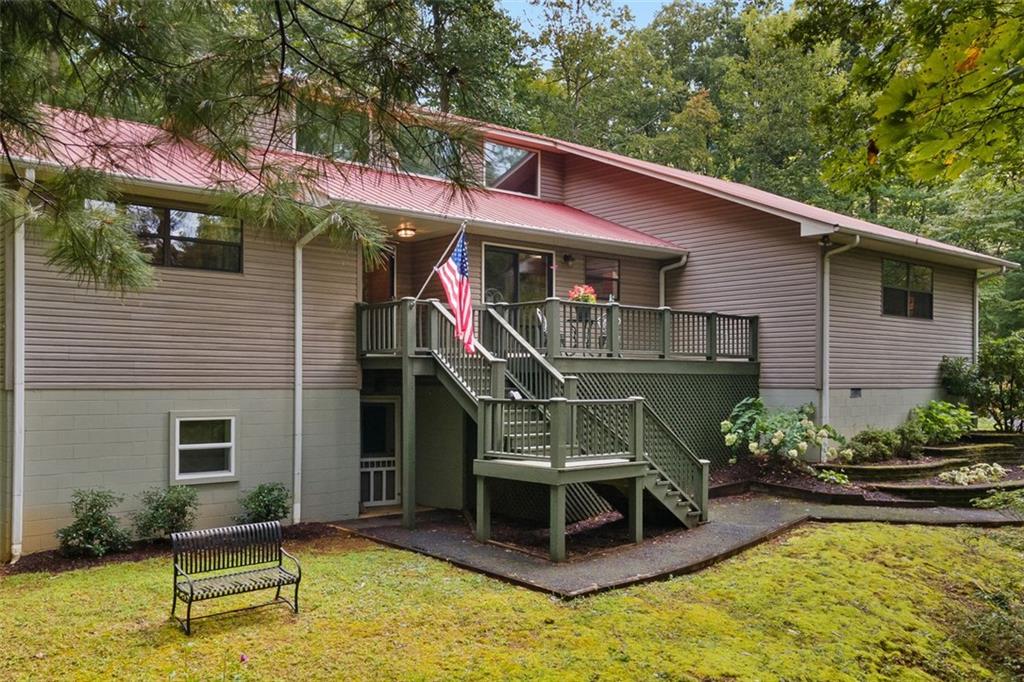 Escape to the mountains in this charming 3-bedroom, 2-bath home located just outside the town of Blairsville, GA. Nestled in a peaceful setting with paved road access, this property offers the perfect blend of comfort and convenience, surrounded by the natural beauty of North Georgia.
Enjoy the outdoors from your screened porch, overlooking mature landscaping that enhances the home’s private and serene feel. Inside, you’ll find a spacious layout designed for easy living, with plenty of room for family or guests. The house also has a partially finished basement, perfect for a media room or man-cave.
Car enthusiasts or hobbyists will love the three garage parking spaces, providing ample storage and functionality. Just minutes away, explore the trails and breathtaking views of Brasstown Bald, Georgia’s highest peak, or spend a day at Vogel State Park, one of the state’s most beloved outdoor destinations.
Whether you’re seeking a full-time residence or a mountain retreat, this property is a rare find in one of North Georgia’s most desirable locations.