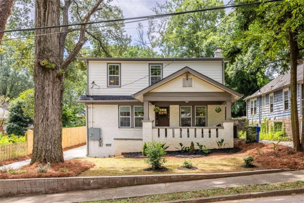 Expanded 1930s craftsman perched on a quiet lot in Sylvan Hills. This home lives large--5 bedrooms, 4.5 baths, and 2 primary suites with over 3300 square feet of living space. A quintessentially southern front porch overlooks Burns Drive, a quiet street in Sylvan Hills dotted with historic homes and shady trees. Inside, you'll find a blend of historic charm and modern updates--coffered ceilings, built-in bookshelves, and a fireside living room with gas fireplace. The kitchen is the heart of the home--a breakfast bar is the perfect spot for busy mornings, and ample tasking space and double ovens make hosting a breeze. French press? Espresso machine? Pourover? All three? This spacious kitchen has room to accommodate your caffeine intake ritual and then some--a dedicated butler's pantry has additional cabinet space, shelving, and beverage cooler. A separate walk-in pantry offers plenty of room for your Costco and Dekalb Farmer's Market hauls, which brings us to the dining room--it's time to brush up on your cooking, because you'll be hosting holidays from now on! The generous dining room comfortably fits everyone, so you'll be able to celebrate milestones and be within earshot of all of the gossip--no need for the awkward kids table in a separate room. Off the kitchen, a big laundry room and mudroom with built-in storage offers maximum convenience, along with a powder room for guests. On the main, the first primary suite has a walk-in closet and roomy tiled bath with double vanity and rainhead shower. Upstairs, a second primary suite also has a large walk-in closet and spacious tiled bath with double vanity and water closet. A third (yes, third!) ensuite is off the upstairs hall, and two additional bedrooms and hall bath round out the upstairs. This home is set on a large lot--over 150 feet deep. The peaceful backyard has a freshly stained deck perfect for entertaining. In the back of the yard, a poured concrete pad flanked by 3 walls is the ideal spot for a fire pit and Adirondack chairs, future greenhouse, or studio. Savvy buyers, the current owner doesn't have the history of the back structure, but based on the terracotta mosaic patio and poured concrete, it was most likely an accessory dwelling of some kind. Sylvan Hills is a sweet community of historic homes on Atlanta's westside. Only a couple of blocks from verdant Perkerson Park, easy access to Tyler Perry studios and the continuously expanding Fort Mac, and a few short blocks to the exploding development along the westside Beltline. Ask about our rate buydown!