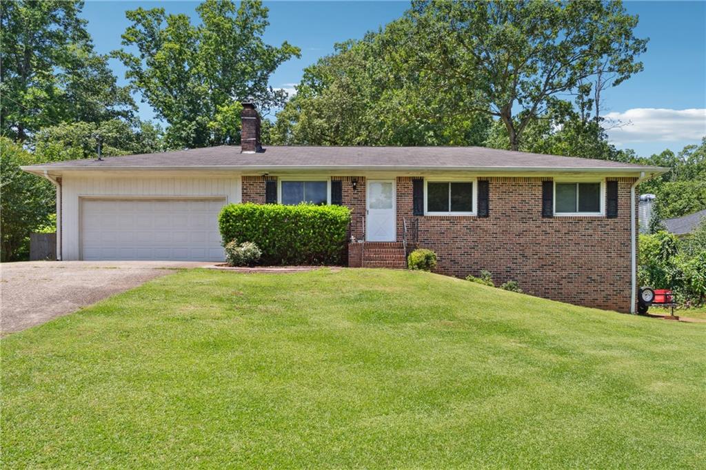 Welcome to 155 Windy Hill Court, a spacious 5-bedroom, 2-bathroom brick ranch, offering both elegance and low maintenance. Situated on a generous .53-acre fenced lot, this property provides ample outdoor space for children to play, pets to roam freely, and plenty of room for gardening or entertaining guests. Inside, the family room is a warm and inviting space featuring a cozy fireplace surrounded by built-in bookshelves, creating the perfect ambiance for relaxing evenings or lively gatherings with friends and family. The large master bedroom is a true retreat, complete with two spacious closets that offer abundant storage options to keep your living space organized and clutter-free. Additional bedrooms are well-sized, ideal for family members, guests, or even a home office or hobby room. Located within the highly sought-after Denmark High School district, this Alpharetta home offers an exceptional combination of space, style, and convenience. Enjoy easy access to local amenities, shopping, dining, and parks, making it an ideal place to start your family’s next chapter in comfort and community. Don’t miss the opportunity to make this beautiful property your new home!