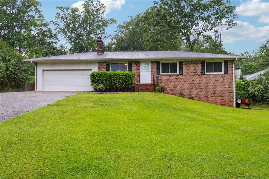 Welcome to 155 Windy Hill Court, a spacious 5-bedroom, 2-bathroom brick ranch, offering both elegance and low maintenance. Situated on a generous .53-acre fenced lot, this property provides ample outdoor space for children to play, pets to roam freely, and plenty of room for gardening or entertaining guests. Inside, the family room is a warm and inviting space featuring a cozy fireplace surrounded by built-in bookshelves, creating the perfect ambiance for relaxing evenings or lively gatherings with friends and family. The large master bedroom is a true retreat, complete with two spacious closets that offer abundant storage options to keep your living space organized and clutter-free. Additional bedrooms are well-sized, ideal for family members, guests, or even a home office or hobby room. Located within the highly sought-after Denmark High School district, this Alpharetta home offers an exceptional combination of space, style, and convenience. Enjoy easy access to local amenities, shopping, dining, and parks, making it an ideal place to start your family’s next chapter in comfort and community. Don’t miss the opportunity to make this beautiful property your new home!