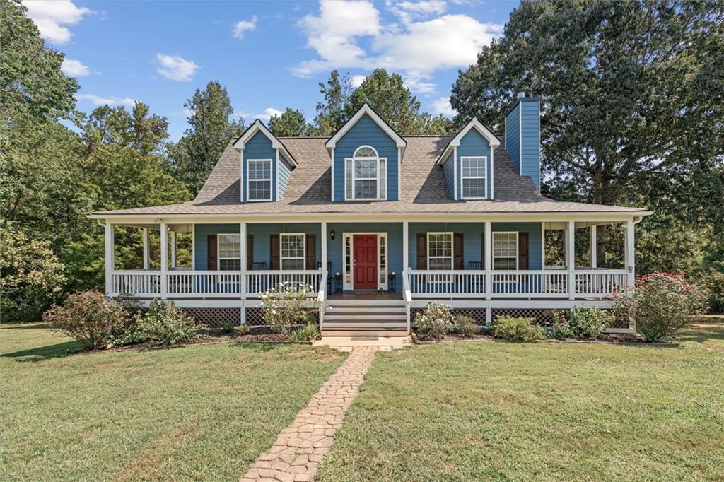 Spacious and versatile 4 possibly 6 bedroom/3 bathroom home on 3 acres offering peaceful country living with all the conveniences nearby! Tucked away on a dirt road, this well-maintained home features a new roof, painted Hardie board siding, and a flexible floor plan ideal for growing families or multi-generational living. The primary suite is on the main level, along with a light-filled living room, dining area, kitchen, half bath, and laundry closet. Upstairs you will find 3 bedrooms, and a full bathroom. The finished basement adds incredible functionality with a living room, and 2 additional rooms. Perfect for bedrooms, an office, nursery, or hobby space. Bringing the total potential to 6 bedrooms. A kitchenette stubbed for a sink in the basement adds even more possibilities for an in-law suite or rental setup. Enjoy 2 porch swings, a chicken coop, muscadines, blackberries, and hunting spots. All on your own private land. Dual HVAC units keep the home comfortable year-round. Conveniently located near I-20, with easy access to shopping, dining, and amenities, you get the best of both worlds: peaceful rural living with everything you need just a short drive away. Schedule your showing today!