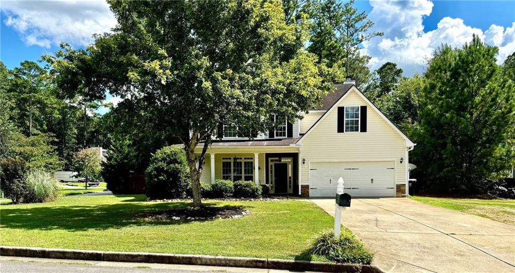 Large corner lot w/ fenced backyard. Gorgeous home with awesome covered front patio, new hardwood flooring, new carpeting, new fresh paint throughout and well cared for home. Inviting two story entrance with classy chandelier. Large kitchen with bright white cabinetry, all brand new stainless steal appliances, solid surface countertops, tile backsplash and pantry. Spacious great room with wall of windows, ceiling fan, and stone fireplace. Separate dining room with window transom and arched entrance. Large master bedroom with double tray ceiling, ceiling fan and a private bathroom featuring double vanity, separate shower, soaker tub plus walk-in closet. Spacious secondary bedrooms with great closet space and ceiling fans. This home features great storage, large two garage two car garage and private fenced in level backyard with a spacious patio.