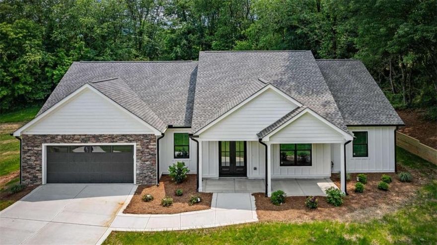 This charming one level living home offers a smart blend of affordability, style, and functionality, tailored for those seeking a hassle-free and comfortable living space. Its thoughtful design prioritizes ease of maintenance and open, inviting areas that encourage relaxation and outdoor enjoyment. The spacious yard provides a safe haven for pets and children alike, with minimal upkeep requirements, allowing you to make the most of your outdoor lifestyle. Inside, a single-story layout ensures seamless accessibility and a flow that's perfect for everyday living. Centered around a large, welcoming living area, the home features eye-catching wood beams that add rustic charm and warmth, creating an ideal environment for both casual family gatherings and quiet evenings at home. The open-concept kitchen overlooks the living room, simplifying meal prep and making entertaining effortless-whether hosting friends or enjoying quiet nights with family. A charming fireplace acts as a focal point, adding comfort and character to the space during cooler seasons. With three generous bedrooms and two full bathrooms, there's ample room for relaxation and privacy for everyone. Practical amenities, including generous closet storage and a spacious laundry area, help streamline daily routines. Step outside to enjoy breathtaking mountain scenery from a covered patio-perfect for outdoor dining, reading, or socializing in a scenic setting. The attached two-car garage offers convenient parking and extra storage space, combining rural appeal with modern convenience. In essence, this delightful home delivers a cozy, scenic, and functional living environment-an ideal retreat that combines outdoor beauty with everyday comfort and practicality.