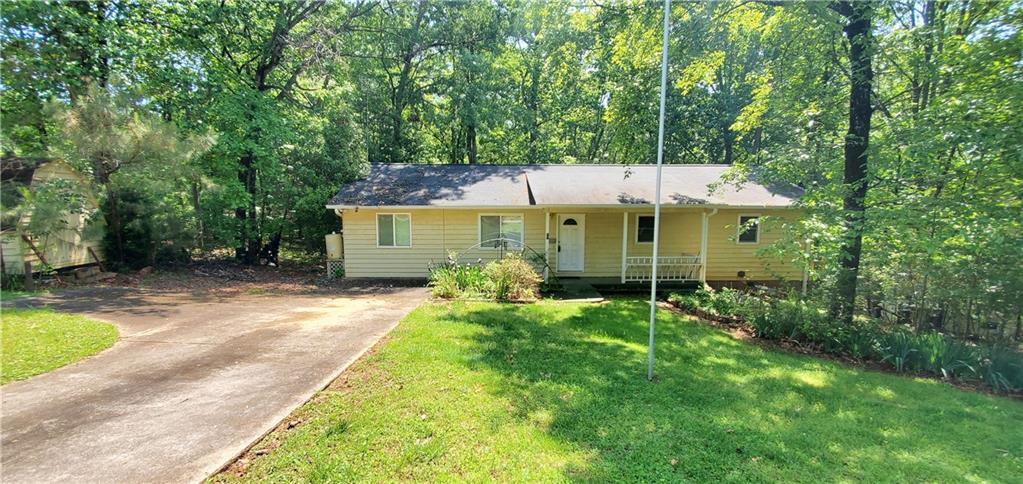 Great first-time buyer / investment home. 3-bedroom 2 bath ranch located in a wooded, private corner lot. Ranch home sitting close to the water located on the south end of Lake Lanier! Home is being sold “AS-IS”. Solid home that has Great Potential!