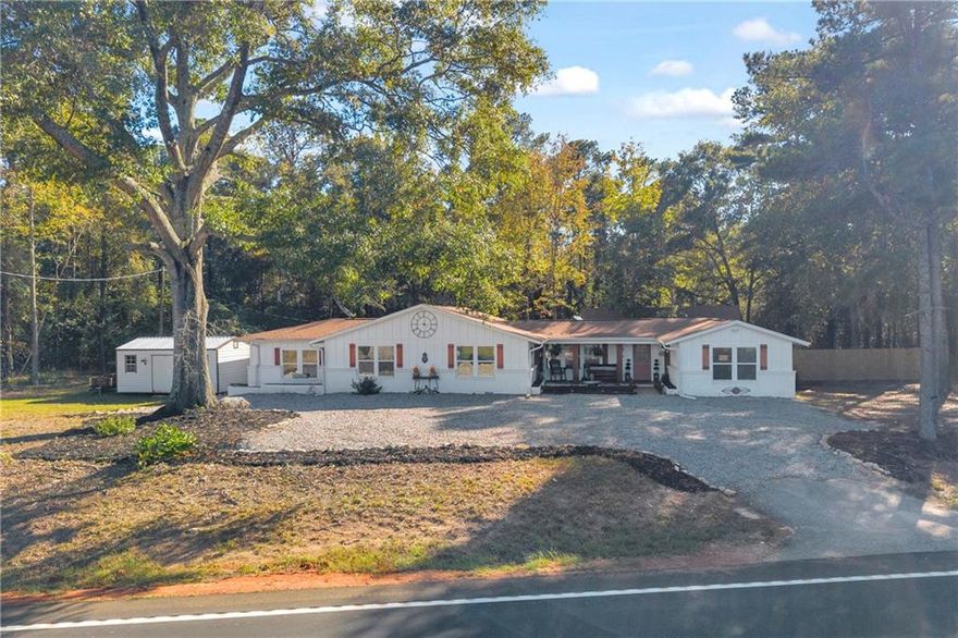 Discover the perfect blend of modern style and country serenity at 1220 Lagrange Hwy.  Beautifully renovated ranch-style home sits on an expansive 3.78-acre lot, offering room to breathe, relax, and enjoy the peaceful surroundings. Featuring 3 spacious bedrooms and 2.5 bathrooms, the home has been thoughtfully updated with stylish finishes throughout, creating a truly move-in-ready retreat.  Step inside to an open-concept layout filled with natural light, where the modern kitchen boasts contemporary appliances and generous counter space, seamlessly flowing into a welcoming living area and dining space ideal for family gatherings or entertaining friends.  The primary suite is a private escape, complete with a luxurious en-suite bathroom featuring a double-head shower and separate garden tub for ultimate comfort. The additional bedrooms offer ample space and storage, making this home as functional as it is beautiful.  Outside, you’ll love the brand-new rear deck, perfect for morning coffee, weekend barbecues, or simply enjoying the scenic views. The property also includes a new metal storage building, fresh gravel, newly mulched landscaping that adds both practicality and curb appeal and a new wood privacy fence.  With its combination of modern upgrades, peaceful acreage, and thoughtful touches, this home is truly a rare find, offering the best of country living with all the conveniences of today’s lifestyle. Don’t miss your chance to make it yours!