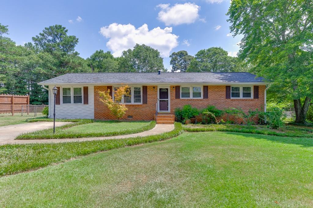 This beautifully updated home is move-in ready with a brand-new roof, refinished floors, and thoughtful upgrades throughout. The former carport has been enclosed, offering a versatile space that could serve as a 4th bedroom, home office, or bonus room. Nestled on a spacious lot, the fantastic yard is a true retreat featuring a detached garage/workshop, playground, garden, and fire pit area perfect for relaxing or entertaining. Inside, you’ll find a home full of character and comfort, ready for its new owner. Conveniently located just minutes from downtown Winterville, the Firefly Trail, and Pittard Park, and only a short drive to Athens, UGA, and all the shopping, dining, and entertainment that Eastside Athens has to offer. Vacant and easy to show. Don’t miss this gem with space to live, play, and grow!