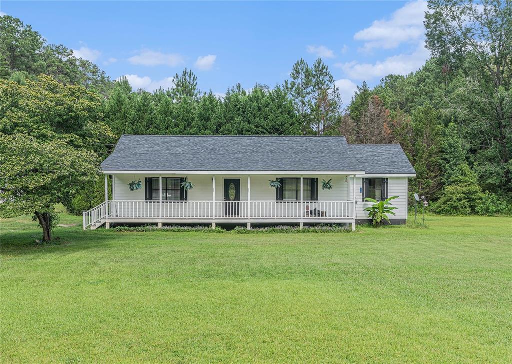 Charming Renovated 3-Bedroom Ranch on 1.73 Acres with Workshop! Welcome to your dream home! This beautifully renovated 3-bedroom, 2 full bath ranch sits on a spacious and level 1.73-acre lot, offering the perfect blend of modern updates and peaceful country living. Step inside to discover a fully updated interior featuring new flooring, a stylishly remodeled kitchen, and renovated bathrooms—all completed within the last five years. Major systems have been upgraded as well, including a new roof, HVAC, electrical, and plumbing, giving you peace of mind for years to come. The septic tank has been recently serviced and is in great condition. Outside, you'll love relaxing on the large front porch or entertaining on the beautiful rear deck that overlooks the expansive property—ready for a garden, outdoor projects, or simply enjoying the space. A standout feature is the oversized workshop, fully equipped with both electricity and water—ideal for hobbies, storage, or business use. This move-in-ready home is the perfect balance of comfort, functionality, and outdoor space—ready for your next chapter.
