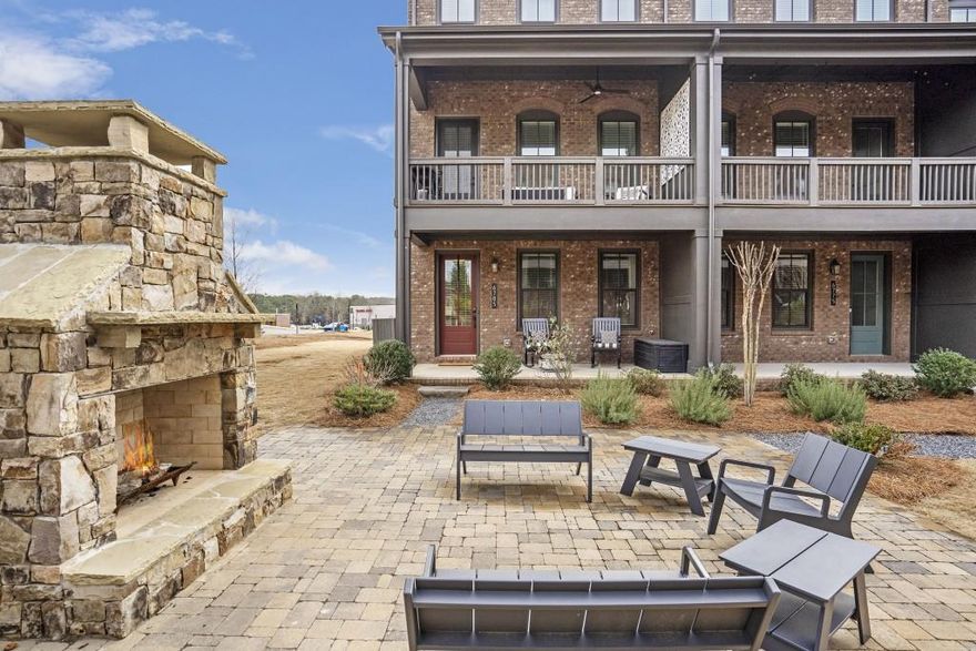 Welcome to Halcyon, Alpharetta/South Forsyth's Premier Live-Work-Play Community!  Discover a new standard of living at Halcyon, where vibrant, walkable urban life meets convenience and tranquility. Nestled just off GA 400, this dynamic community offers a healthy lifestyle with easy access to Big Creek Greenway, a variety of restaurants, shops, Trader Joes, and much more. It's the perfect location to enjoy all the amenities of modern life, while being surrounded by nature.  This meticulously designed terrace-level, end-unit home strikes the perfect balance between modern elegance and functional living. The open-concept floor plan is flooded with natural light, creating a bright and inviting atmosphere throughout. The main level features a spacious dining room and a gourmet eat-in kitchen, complete with a gas cooktop, sleek hood vent, premium cabinetry, and stainless steel appliances. Overlooking the large living room, this kitchen is perfect for entertaining. Step outside to one of two covered outdoor living spaces and relax with beautiful courtyard views.  The private owner-suite is a true retreat, featuring a luxurious bath and offering ultimate comfort and privacy. With two additional bedrooms, each with its own en-suite bath, every member of the household will enjoy their own space and privacy. The home also boasts a two-car garage, ensuring both luxury and convenience.  Halcyon Garden community's centerpiece features a clubhouse with restrooms and kitchen, a refreshing swimming pool, and a beautifully manicured courtyard complete with an outdoor fireplace, ample seating, and lush green space ideal for relaxation or hosting gatherings with friends and family.  For outdoor enthusiasts, the home is perfectly situated along the Big Creek Greenway, granting direct access to over 26 miles of scenic trails. Enjoy the serenity of nature while being just minutes from the vibrant downtown Alpharetta.  Don't miss out on this rare opportunity to own a move-in-ready home in one of Alpharetta's most sought-after neighborhoods. Schedule your showing today and experience the best in modern living, convenience, and community!
