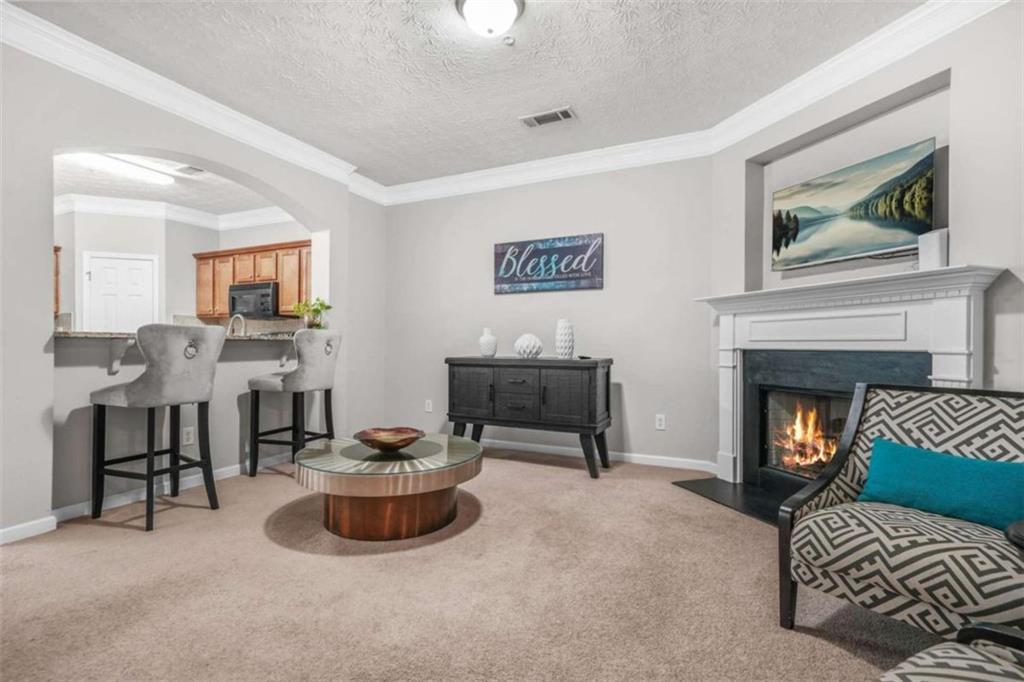 Welcome to this beautifully maintained 3-bedroom, 2.5-bath townhome nestled in a desirable and established neighborhood. Seller to contribute $7000 towards buyers closing cost or rate buy down with accepted offer. A wide, hardwood-floored hallway welcomes you into a spacious family room, highlighted by elegant double arch openings that create an inviting flow throughout the main living area. The open-concept kitchen features hardwood flooring, granite countertops, and a blend of stainless steel and black appliances. A breakfast bar with seating for three and a charming center island provide both functionality and style, seamlessly connecting to the cozy breakfast area perfect for casual dining. The generous owner suite offers vaulted ceilings, a large walk-in closet, and ample natural light. Secondary bedrooms are equally spacious, each with vaulted ceilings, creating an airy and open feel. New Roof installed Feb. 2025, HVAC Installed 2021, Hotwater Heater Installed in 2021. All exterior maintenance are taking care of by the HOA.....worry free home. This well-maintained home is truly move-in ready all it needs is you.