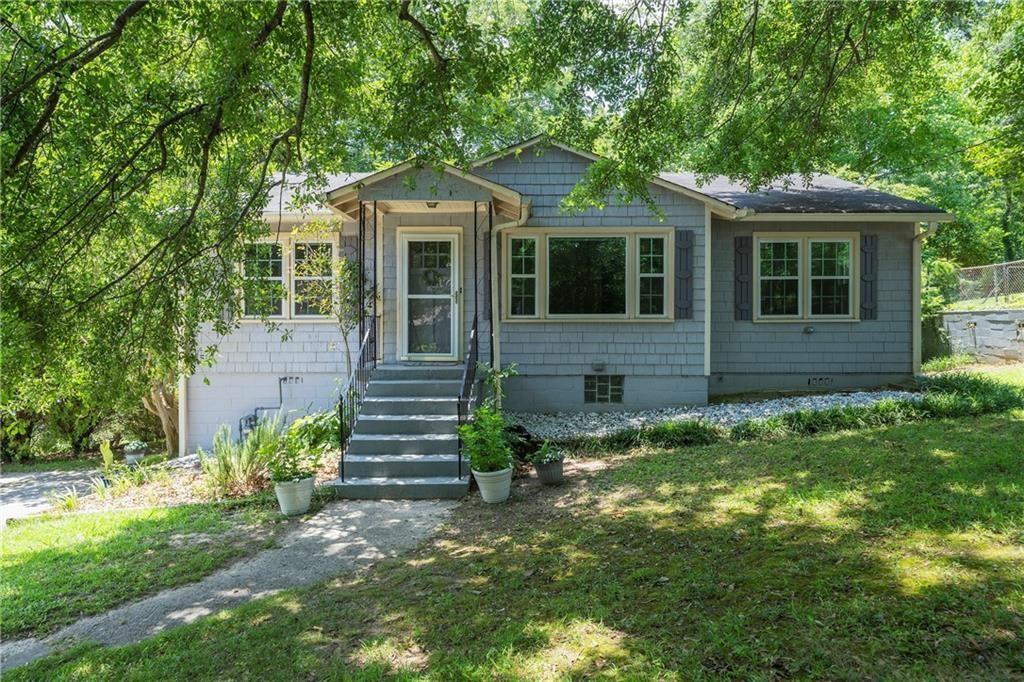 A cozy bungalow in the heart of Briarcliff Heights which is prime Intown location and minutes from Emory University, the CDC, and quick access to I-85, GA-400, and I-285, facilitating easy commutes across the metro area. It's a 4-bedroom, 2-bath home blends classic charm with thoughtful updates, including granite countertops, freshly painted cabinetry, stainless steel appliances, and a pantry closet in the kitchen. Original hardwood floors run throughout the main level, complemented by a large living room, separate dining room, and a bright sunroom perfect for a large home office, creative studio or second living room. Downstairs, a partially finished basement features a bedroom and full bath, laundry area and a dedicated workroom with generous storage ideal for hobbies, tools or future expansion. Enjoy the great outdoors in your deep, shaded backyard with a playset, or in the spacious front yard framed by a stunning 100+ year-old oak tree. There is parking for multiple cars on the long driveway with plenty of additional off-street parking. Nearby MARTA bus routes, including lines 19 and 8, with stops within walking distance and the new Arthur M. Blank Children's Healthcare of Atlanta campus. Close to local parks and public pools operated by DeKalb County, offering outdoor activities and community programs. Don't wait to take advantage of this vibrant, walkable neighborhood where neighbors gather for Wine Down Wednesdays and other fun events. This home offers a unique blend of classic charm and an unbeatable location. Don't miss the opportunity to make it yours!