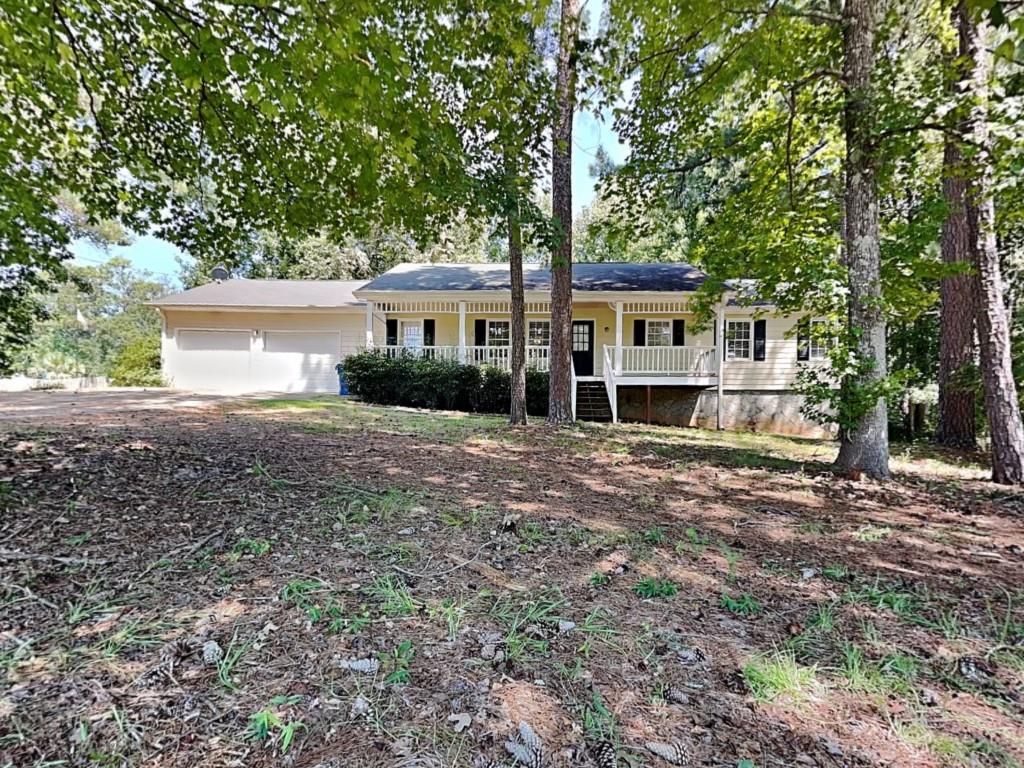 Charming 3-bed, 2-bath ranch on nearly an acre. Enjoy the rocking chair front porch, spacious living room with vaulted ceilings, and a cozy fireplace. A separate dining room for family and holidays. The unfinished basement provides great potential for added living space or storage. Quiet neighborhood with easy access to I-75, shopping, and parks