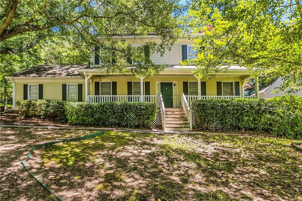 Discover this beautifully split-level home nestled in the quiet, established Summit Chase neighborhood. The inviting layout features a sun-filled enclosed porch, a spacious living room with a cozy fireplace and built-in bookcases, and a separate dining area perfect for hosting. The kitchen includes a breakfast bar and a dedicated breakfast nook, blending functionality with comfort. Upstairs, the primary suite offers dual closets and a private bath, while two additional bedrooms provide space for guests, family, or a home office. Outside, enjoy a private, fenced backyard ideal for relaxing or entertaining. Located just minutes from shops, parks, and dining, this home combines classic charm with modern convenience.