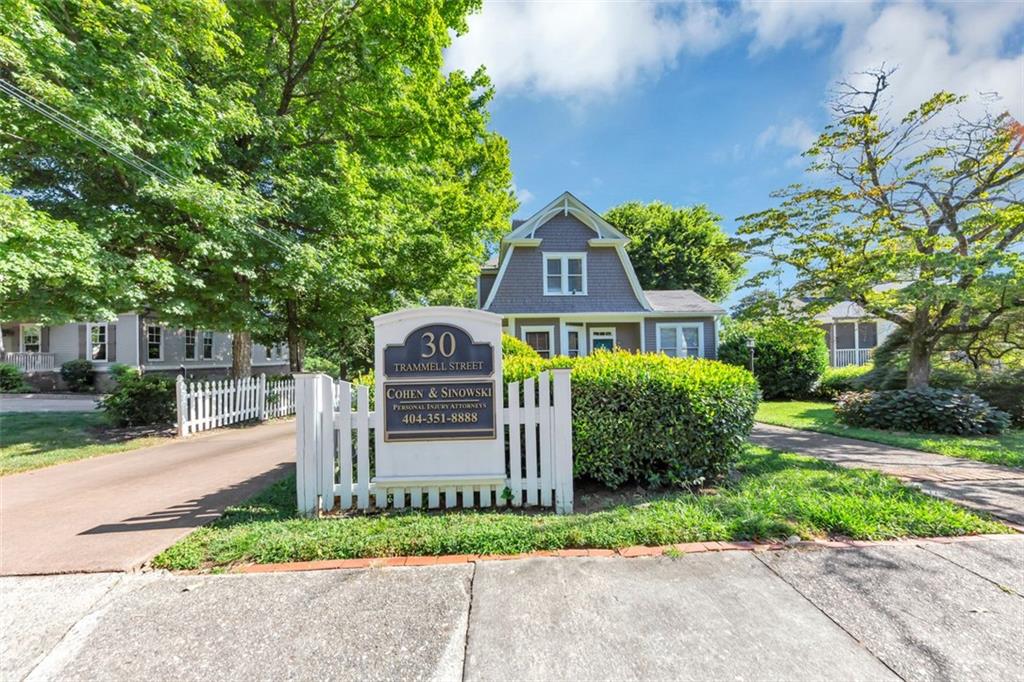 Welcome to 30 Trammell St SW, Marietta, GA 30064. An Historic Mixed-Use Complex Near Marietta Square just steps from the Marietta Square and within walking distance to the Cobb County Courthouse. This charming 1905 historic property offers a rare opportunity to own a piece of local history with modern-day functionality. Currently operating as an attorney's office, the property features a classic layout with a thoughtful blend of historic charm and professional utility-including original moldings, a welcoming foyer, reception area, private offices, and bathrooms. Zoned O/I (Office/Institutional), the property cannot be rezoned, but a variance may be obtained to allow for residential use, making this an excellent live/work opportunity or a chance to convert the space back to a private residence. Additional highlights include: Ample rear parking Second private entrance for added convenience Excellent visibility and accessibility in the heart of Marietta. Whether you're seeking a boutique professional space or a flexible mixed-use opportunity, this property delivers timeless value in an unbeatable location.