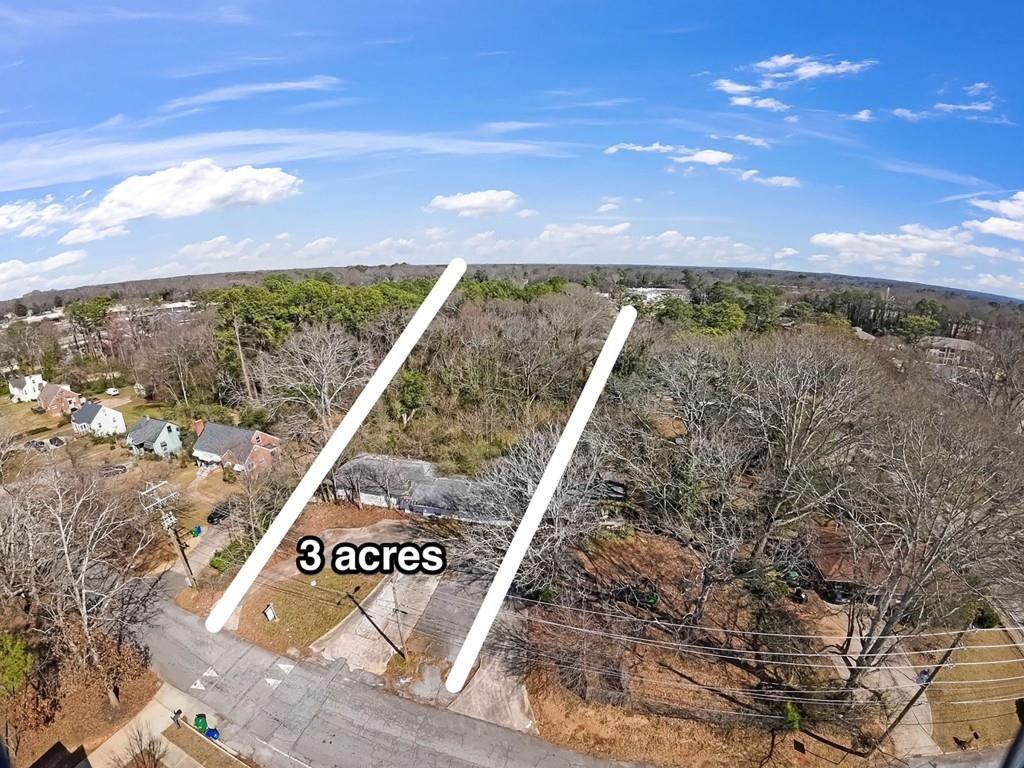 A Springboard for Your Vision. Nestled in a thriving community surrounded by mature trees and well-established homes, this 3-acre city lot is brimming with potential. While the existing structure may be ready for a fresh start, the lot itself is a rare gem: Prime Location: A newer developed area buzzing with energy. Convenience: Near restaurants, businesses, and major interstates. Opportunity: Perfect for creating a modern enclave that complements the vibrant surroundings. Imagine a new community within an already thriving neighborhood a place where creativity and potential blossom. Bring your imagination, and let's turn this blank canvas into something extraordinary this spring.
