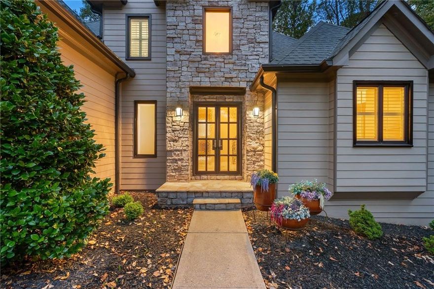 Peaceful and PRISTINE on Lake Allatoona - This rare find in popular Woodstock backs to Corp Property and the lake, with a paved cart path to the marina and exclusive community party dock, for year-round lake access and no dock maintenance! You will absolutely love watching the wildlife from the screened porch and the true retreat feel of the home, with Main Level Living and thoughtfully designed spaces that have been meticulously maintained by one owner! The gorgeous 2-story foyer features marble and hickory hardwoods, custom iron rails and doors, and over $40k in new windows throughout! Primary suite on main with picture perfect views of the park-like backyard, pristine white kitchen, 2 story great room with gas log fireplace, full unfinished basement with boat door and the outdoor shower are just a few of the incredible highlights of this custom home. HVAC with two upgraded Trane units just serviced with a clean bill of health, septic has been inspected and pumped, tankless water heater is only two years old, fresh exterior paint & trim and so much more! Lovinggood Landing is a golf cart community with exclusive access to Victoria Marina on Lake Allatoona, with boat slip rentals, boat launch, sandy beach, restaurant & bar with live music and jaw-dropping sunsets over the water to enjoy! You’ll discover very quickly how fun life can be when you have all the offerings of booming Downtown Woodstock, highly ranked schools AND the lake life right at your fingertips!