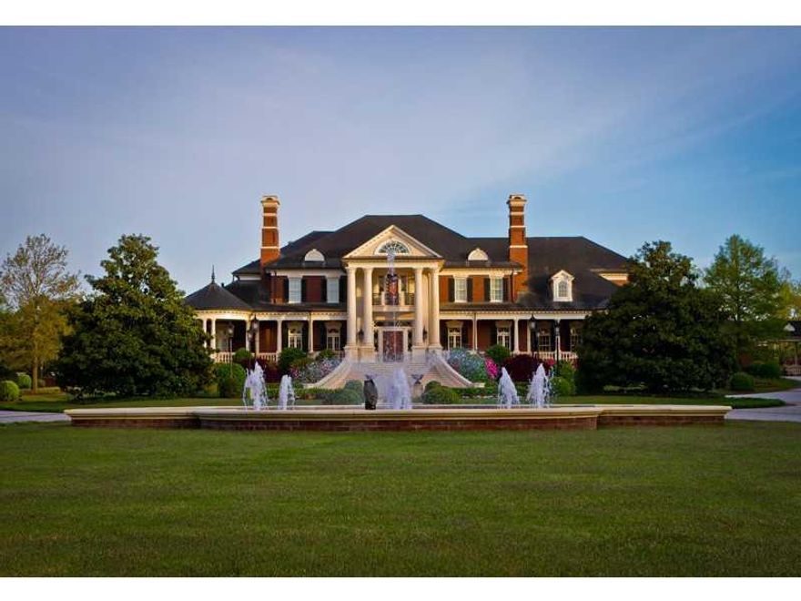 Spectacular gated custom estate on 14 acres with magnificent interior details. This home has a 14 car garage, separate pool house, 5 kitchens, 20 HVAC units, 3 laundry rooms, saltwater pool with outdoor fireplace, attic with custom cabinetry, elevator, service access driveway. House is electronically controlled. Custom built but owner never moved in. Every piece of woodwork is custom and each piece of stone carefully selected. Too many details to possibly describe - this is a masterpiece of construction. Underground tunnel connects detached garages with main house.