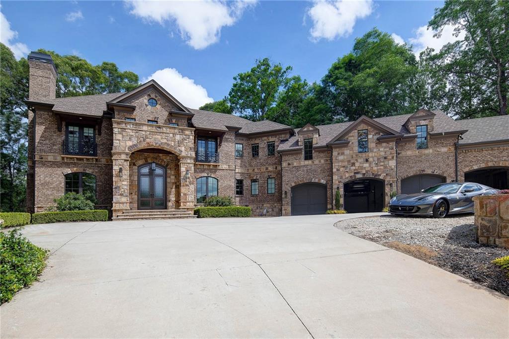 The gated estate on the corner lot in N. Buckhead is a stunning departure from ordinary. Soaring two-story foyer with w/silver leaf dome & dramatic staircase makes a memorable statement. Dining Room w/enchanting Venetian plaster walls. Casual opulence in kitchen & keeping room overlooking resort-like cabana, pool, sport court. One-of-a-kind master closet is a glamorous & functional w/room for 300+shoes. Plenty of room for entertaining in guest home & sleek finished basement. Shiny surfaces, muted colors, & sensual fixtures were carefully selected to maintain drama & warmth. Make an offer private resort-style walk-out backyard has a large, salt-water, heated pool & spa, putting green, & impressive brick pool cabana with full outdoor kitchen, heaters, high ceilings with fans, TV lounge area, dining area! The property is meticulously lined with privacy trees and lush landscaping. State of the art home technology throughout with Crestron home automation and speakers throughout.
