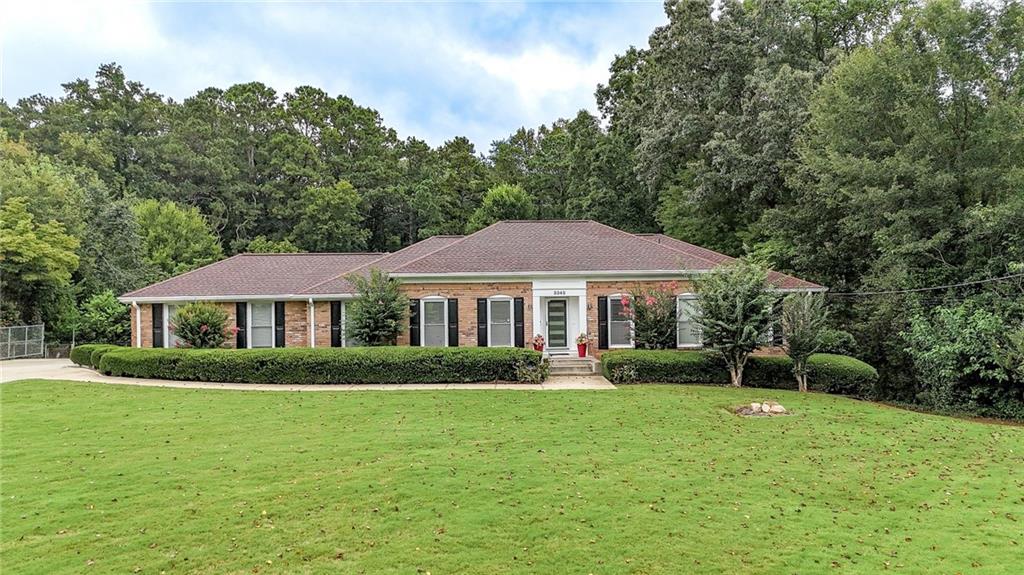 Welcome to this beautifully appointed 5-bedroom, 4.5-bathroom ranch-style home located in the prestigious Terrell Mill Estates subdivision in East Cobb. Sitting on over 1 acre of lush, private land, this expansive 4,900+ sq. ft. residence delivers timeless luxury, modern updates, and exceptional indoor-outdoor living. From the moment you arrive, you’ll be captivated by the home’s curb appeal and elegant charm. Inside, you’ll discover a gourmet chef’s kitchen featuring high-end appliances, custom cabinetry, and a spacious island—perfect for entertaining or preparing everyday meals. The open-concept layout flows into bright and inviting living and dining spaces designed for both comfort and style.
The secondary bathrooms have been updated. Delight in a spa-inspired primary suite, with a jetted tub and thoughtful design, elevating your daily routine. The fully finished basement provides versatile space for a home theater, gym, office, or in-law suite, tailored to fit your lifestyle needs.
Step outside to your backyard retreat featuring a saltwater inground gunite pool, a stylish pergola, and plenty of green space to relax, entertain, or play.
Located just minutes from I-75, I-285, and The Battery Atlanta, you’ll enjoy unbeatable access to world-class dining, shopping, and entertainment while still enjoying the peace and privacy of one of East Cobb’s most established neighborhoods.
This move-in-ready home in Terrell Mill Estates is a rare opportunity to enjoy the best of East Cobb living—schedule your private tour today!