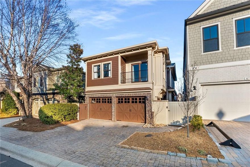 Welcome to this beautiful European Craftsman in the sought after community, The Village at Towne Lake! Exceptional design elements feature throughout the high-quality built property. You’re welcomed into the home with an exquisite living room featuring a floor to ceiling double-sided fireplace, custom built-in’s and an abundance of natural light. The open concept kitchen overlooks a lovely dining room that leads directly through French doors to the professionally landscaped outdoor courtyard, a perfect arrangement to entertain. A convenient half bathroom leads upstairs where you are greeted with an array of custom built-ins and a very convenient bonus workspace. The large primary bedroom is paired with a stunning ensuite bathroom, including walls of travertine tile, a double vanity with stone counters, a jetted tub, and a custom tiled walk-in shower. Across the hall features a full bathroom with double vanity and tiled shower, and two additional bedrooms, one includes a private balcony overlooking the community! Roof, WH, and HVAC are all recently replaced and the home is newly painted inside and out! The Village at Towne Lake is a gated subdivision with first class amenities, including a pool, tennis and bocce ball courts, and numerous pet parks. Located a few minutes to Downtown Woodstock, this home presents the opportunity to live a wonderful lifestyle near all the restaurants, shops and nightlife! It’s yours for the taking.