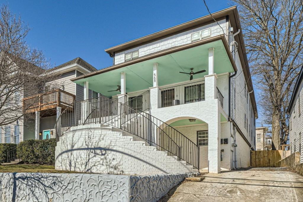 Fully Renovated Beltline Beauty with Exceptional Income Potential! The Current Income is $16,800 per month, based on a month-to-month corporate lease. Welcome to 568 John Wesley Dobbs, a classic yet Fully Updated Home in the heart of Old Fourth Ward, one of Atlanta's most Vibrant and Walkable Neighborhoods. Just Steps from the Atlanta Beltline, Freedom Trail, Krog Street Market, Freedom Barkway Dog Park, and the Shops and Dining of Inman Park and Poncey-Highland, this home places you in the center of it all. The welcoming Covered Front Porch with ceiling fans is perfect for Year-Round Enjoyment just grab a drink and enjoy the view. Inside, the home is filled with Natural Light, boasting an Elegant Living Room with Tray Ceilings, Arched Doorways, and New Hardwood Floors. The Open Concept Floorplan includes a space for Formal Dining, a Fireside Breakfast Nook, and a Dreamy Chef's Kitchen featuring a Marble Waterfall Island, White Cabinets, Marble Countertops and Backsplash, Stainless Steel Appliances, and abundant Storage no detail was overlooked. The Main-Level Primary Suite offers a Spacious Walk-In Closet and a Spa-Like Ensuite with a Soaking Tub, Marble Shower, Dual Vanity, and chic finishes. An additional Bedroom and Full Bath complete the Main Level. Upstairs, you'll find Three Additional Bedrooms, and Three beautifully Updated Full Bathrooms. The Fully Finished Daylight Basement Level is a standout with its Own Private Entrance an ideal setup for Short-Term Rentals, Long-Term Tenants, or a Multigenerational Living Arrangement. This separate Living Space features a stylish Open Concept Living Area, a full Kitchen with Quartz Countertops, White Cabinets, and Stainless Steel Appliances, plus a Convenient Powder Room. The Terrace-Level Primary Suite includes a Walk-In Closet, Spa Bathroom with Soaking Tub, Separate Shower, and Dual Vanity. Two Additional Bedrooms, a shared Full Bath, and a Flex Space (perfect for a Home Gym or Office) make this space incredibly versatile. Step outside to enjoy the Two-Story Rear Deck, perfect for Hosting Guests or Relaxing Outdoors. The Massive Flat, Fully Fenced Backyard is a rare find in Intown Atlanta. A Long Driveway offers ample Parking for you and your guests. Whether you're an Investor looking for Serious Rental Income, a homeowner seeking Flexible Living Options, or someone who simply wants to be in the Middle of it All, this home delivers. With Easy Access to Parks, Restaurants, Shops, and Entertainment, this home is the Perfect Blend of Style, Functionality, and Location. Don't miss your chance to live and earn in one of Atlanta's Most Desirable Neighborhoods!