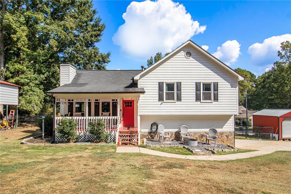 Move-In Ready Charm! This cozy open-concept home features an updated kitchen and bathrooms, a warm wood-burning fireplace is perfect for those chilly, winter days. Enjoy outdoor living with a fenced backyard and extended deck, perfect for relaxing or entertaining. Talk about all the details that will give you peace of mind: The roof is 6 years old, HVAC is 8 years old, The upgrades were completed in 2022. you will love the new floors, new windows, and the interior paint. The exterior was repainted in 2021. The crawlspace was incapsulated in 2023.