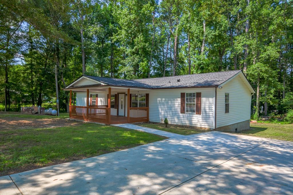 This exceptional property at 995 Highway 101 S, Temple, Georgia 30179-2886 offers the perfect blend of prime location and high-end design. With easy access to I-20, shopping centers, 15 minutes away of Walmart and Home Depot, 4 minutes away from a gas station and top-rated schools, Union Park is located in the neighborhood, and the property boundaries match with this park's limits. This home is ideal for those seeking comfort and style. The residence features 3 spacious bedrooms and 2 full bathrooms, highlighted by granite countertops in the kitchen, new premium vinyl flooring, and porcelain tile in key areas as the bathrooms to bring the luxury sensations, along with luxurious finishes throughout. The kitchen, equipped with high-end appliances, seamlessly flows into the living space, creating an inviting atmosphere for gatherings. The bedrooms include walk-in closets, while the bathrooms showcase marble or premium ceramic tiling with elegant fixtures. Outside, the property boasts a flat lot with a generous backyard, perfect for family barbecues and entertaining guests. A rare opportunity to own a home that combines elegance, functionality, and a space designed for unforgettable moments. Schedule your visit today!