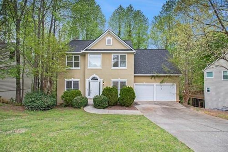 PRICED TO SELL -- Welcome to the best bang for your buck in Windgate! This home is huge and features 6 bedrooms and 3.5 baths. The main level features granite tops, white cabinets, stainless steel appliances, and hardwood floors. Walk out to a covered deck for entertaining with privacy of trees from your neighbors. Upstairs you'll find 4 generous sized rooms and 2 baths. The basement level has multiple levels, and each has its own back deck for relaxing. Come see this beauty today.