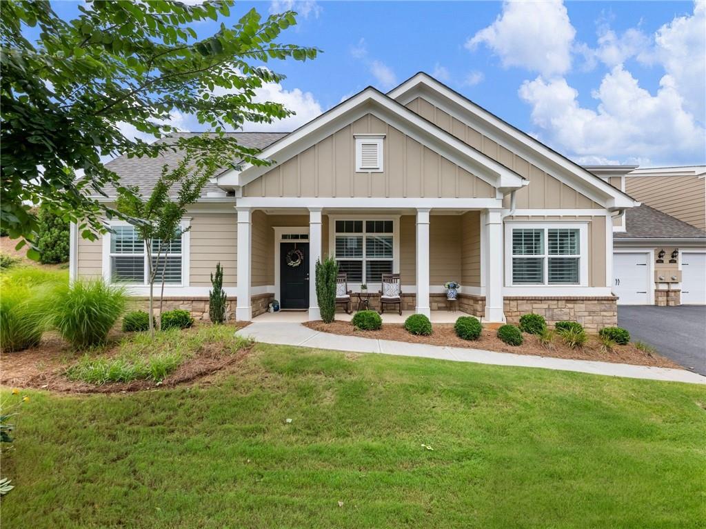 Beautiful, Low-Maintenance Home in Prime Forsyth Location — The Orchards at Central Park - Spacious and thoughtfully designed, this three-bedroom, three-bath home features a main-level master suite with its own sitting area or study, ideal for reading, relaxing, or pursuing hobbies and a spa-like master bath with his/hers closets. An open-concept layout ensures bright, comfortable living, while the media loft offers versatile space for guests, entertainment, or crafts. Stylish, easy-care finishes include hardwood and tile flooring throughout the main level, plantation shutters, upgraded light fixtures, black granite sink and so much more! Lightly lived-in, move-in ready, and immaculately maintained. Key Features: two-car garage, ample storage space, including expanded attic/closet areas, peaceful walking and biking trails with direct access to Central Park and the Senior Center. Community pool & clubhouse — perfect for social gatherings. Pickleball courts. Vibrant social programs and wellness activities, tailored to active adults. Sidewalks and street lights for added safety and convenience. Unbeatable location — just minutes from shopping, dining, healthcare, and easy access to GA-400. The Orchards at Central Park is a resort-style 55+ community. Live your best chapter here!