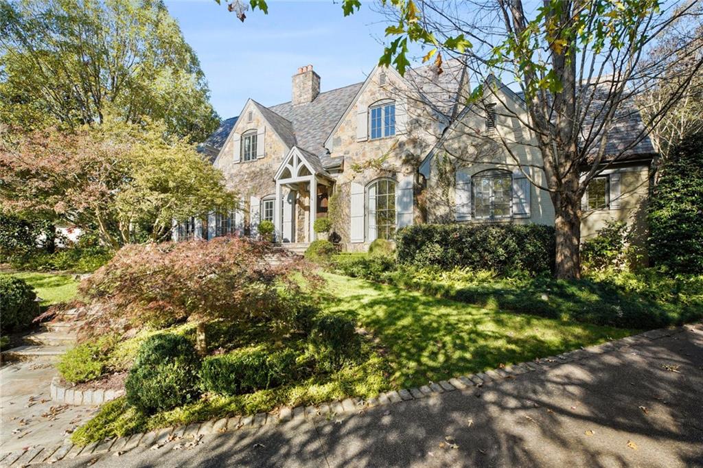 Traditional Tuxedo Park home is perfectly situated on 1.4+/- acres & offers a private setting. Entrance foyer leads to oversized living spaces ideal for entertaining. Update kitchen offers stone counters, stainless appls & opens to the family rm w/antique beams & fireplace. Sought-after primary bedroom on main sits in the back of the home & overlooks the pool & backyard. Main level also offers an addtl bedroom. Upper level has 4 bedrooms & 3 baths, as well as 2 rec rms w/kitchenette. Beautiful manicured ground offers level grassy area & beautiful mature landscaping.