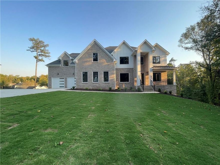 **NEW CONSTRUCTION** Discover unparalleled luxury living in the esteemed Indian Hills subdivision, and the highly rated award-winning East Cobb Schools, including Walton High School. The combination of a prestigious community and top-tier schools further enhances the appeal of your dream home's location, making it an even more desirable place to live and raise a family. The combination of the German-made Trocal 70 AD window system for optimal sunlight distribution and the overall design that emphasizes open spaces and natural light is truly impressive. The high-end finishes, and built-in features throughout the house add to its sophistication and elegance. The spacious and open floor plan lends itself to both entertaining and comfortable family living, creating a warm and inviting atmosphere. The emphasis on natural light not only enhances the aesthetic appeal but also contributes to energy efficiency by reducing the need for artificial lighting and heating. The master suite, with its luxurious bathroom, offers a true sanctuary for relaxation. The other bedrooms and bathrooms continue the theme of spaciousness, natural light, and opulent finishes, creating an environment reminiscent of a spa. The vivid picture of a thoughtfully designed and meticulously crafted dream home showcases impeccable taste and attention to detail. It's sure to be a space that not only impresses your friends and family but also provides you with the utmost comfort and enjoyment.