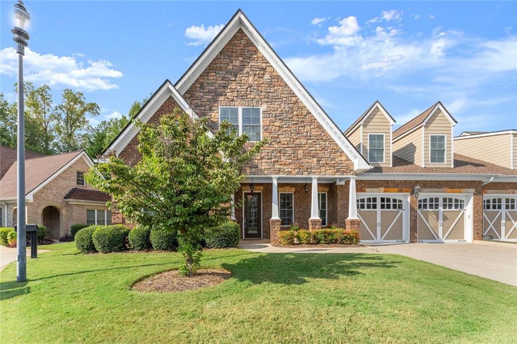 This luxurious home is located in the desirable community of The Oaks at Sandy Springs in East Cobb. This home has been meticulously maintained, it features two levels serviced by a private Elevator. The main level is designed for both comfort and elegance. The living room includes a fireplace, coffered and beamed ceilings, crown molding, and built-in selving, creating an inviting atmosphere for relaxation or entertaining. The eat-in kitchen is a chef’s dream with stone countertops, a custom range hood, stylish backsplash, bar seating, and plenty of cabinet space. An elegant dining room with a tray ceiling and a private office add to the functionality of the layout. The primary suite is a true retreat with a tray ceiling, crown molding, and a serene ambiance. An additional bedroom includes a walk-in tub and walk-in closet, providing both comfort and accessibility. Gorgeous hardwood floors flow throughout, adding warmth and sophistication.
The second level offers its own private retreat with a spacious secondary primary suite featuring a bedroom, full bath, and walk-in closet, large living area with an additional walk-in closet and generous storage space makes the upstairs level perfect for guests or extended family.
The outdoor living is just as impressive with a spacious covered patio and a private backyard, ideal for gardening and entertaining. With thoughtful architectural details, and a welcoming community, this Marietta residence presents an unparalleled opportunity to enjoy luxurious living in a vibrant and well-maintained 55+ neighborhood.