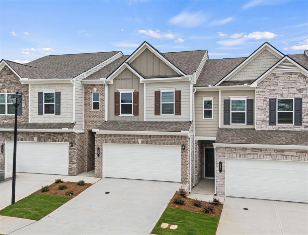 Move-in Ready! The Norwood II floorplan, a thoughtfully designed home by Smith Douglas Homes in the sought-after Franklin Manor community. This stunning residence blends modern design with everyday comfort and offers everything you need for stylish, easy maintenance living. Step inside to discover an open-concept layout that seamlessly connects the kitchen, dining and family room-perfect for entertaining or relaxing with loved ones. The spacious deck extends your entertainment space outdoors. Enjoy upscale touches throughout, including nickel hardware, enhanced lighting package, upgraded cabinetry, granite countertops, vinyl plank flooring on the main level and stainless steel appliances. A sleek linear fireplace adds a cozy focal point in the family room, while the iron rail staircase leads to a versatile loft area. Upstairs, you'll find two secondary bedrooms, a convenient laundry room, and a private primary suite featuring a tray ceiling, walk-in closet and a spa-inspired bathroom with a tiled shower and double vanity. With 9ft ceiling heights on both levels, the home feels airy and light-filled throughout. Lawn maintenance is included in the HOA, giving you more time to enjoy your new lifestyle. Photos representative of plan and not of actual home under construction. Take advantage of seller incentives with use of our preferred lender. Don't miss this opportunity to own a beautifully crafted home in Franklin Manor!!!
