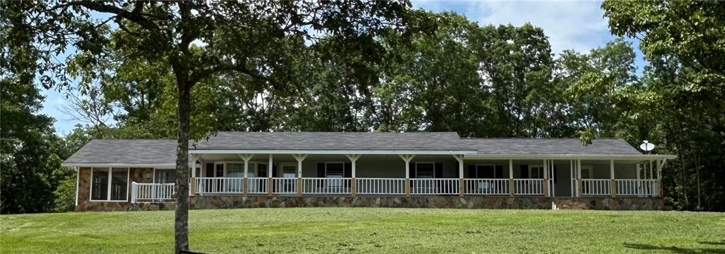 15 MIN. TO BLUE RIDGE, 15 MIN. TO MURPHY, (HOME OF THE CHEROKEE CASINO). STEPLESS REANCH WITH PASTURE & 2.25 +/- ACRES OF UNRESTRICTED PROPERTY. FULL LENGTH COVERED PORCH AND 4/3, YEAR ROUND MOUNTAIN VIEW. SET BACK FROM THE ROAD WITH a long circular cement driveway, 1 detached garage THAT CAN EASILY BE A STABLE OR KENNEL, SWEEPING PASTURE OUT FRONT, 2+ACRES OF UNRESTRICTED, WOODED ACREAGE. Perfect opportunity for investor, contractor or a homeowner who wants his own UNIQUE estate. House IS BEING SOLD AS/IS, WITH RIGHT TO INSPECT. The exterior, decks and porch have been repaired & freshly painted. The interior was in the renovation process, now clean and awaiting your design expertise. Flexible floorplan allows for MANY options. A home-based business would thrive here, EASY ACCESS & HIGH VISIBILITY with 267' frontage on HWY 60. Exterior has native flagstone accents and professional landscaping. DO THE MATH, 4/3 HOME WIRED FOR 2 kitchens, NANNY SUITE (ADU) 1/1. Circle drive, extra parking areas, & RV parking pad.
Interior needs s face lift, trim, paint, kitchen update. No broken windows, minimal sheetrock work, floor covering as needed. All bathrooms have double vanities with separate tub & showers. Plumbing is intact, well & septic in working order. Ceiling fans ready to install in every room. Easy project for DIY OR SEMI-PRO.