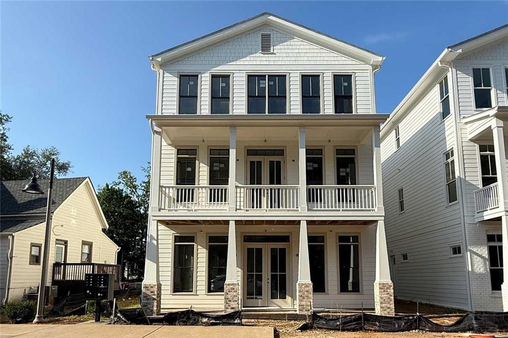 Unlock the extraordinary with this unparalleled opportunity to own a LIVE/WORK building nestled in the heart of Adair Park in vibrant Downtown Woodstock. Named one of Money magazine’s TOP 50 places to line in the US, flourishing Woodstock is renowned for its chef driven restaurants, independent retailers, breweries, performing arts and more. This remarkable property boasts prime commercial space on the ground floor, ideal for entrepreneurs and businesses looking to thrive in a bustling community. Above, discover two distinct condos, each offering 2 bedrooms, 2 full bathrooms, and a full kitchen, presenting multiple opportunities for income streams. Whether you're an aspiring business owner, an astute investor, or seeking the ultimate live-work balance, this property presents a rare chance to own a piece of Adair Park's dynamic landscape.