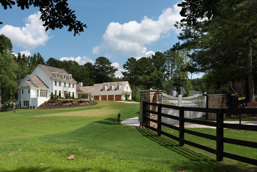 Stunning Newly built Private Estate home located on 7+ acres overlooking Providence Lake. This amazing custom built home is just minutes from Downtown Alpharetta and Avalon. An entertainer's dream with every architectural detail imaginable. Chef's kitchen w/ Sub Zero and Wolf appliances, custom cabinets with two huge islands, Open to Family Room overlooking the backyard oasis, which includes a pool and 33 acre lake. Pasture surrounds home with several storage sheds and plenty of room for a barn. Gorgeous separate Dining Room, Butlers pantry with ice maker and wine cooler. Separate den with fireplace, exquisite millwork throughout home. Master on main complete with separate steam shower and soaking tub. Master opens to private patio overlooking lake. Smart Home with the latest technology including security system with cameras covering full exterior of the home. 11 ft ceilings on main, 10 ft on second and basement, Ensuite on first floor with separate shower and soaking tub. Office on main with custom built-ins, formal and informal powder rooms. 3 large bedrooms upstairs, each with private bath. Two Laundry rooms, upstairs and on main. 4th bedroom upstairs can be used as in-law suite, has private bath, refrigerator, microwave and dishwasher.
