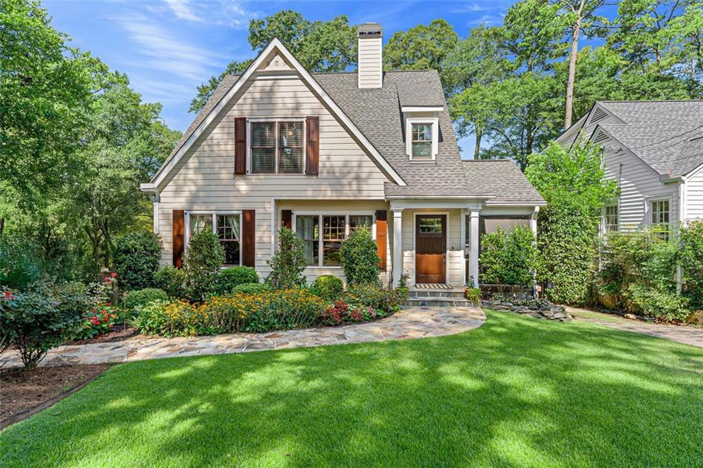 Welcome to this stunning, completely renovated 1939 home located in the heart of Peachtree Hills. Thoughtfully redesigned by Kemp Hall Studio, this 3800 sq ft 4-bedroom, 4.5 bath home was completed in 2016 and masterfully blends modern elegance with timeless architecture. Main level features include warm maple floors throughout, formal living and dining room alongside a stylish half bath. The heart of the home is a gourmet kitchen with Carrara marble countertops, Wolf and Bosch appliances, and a walk-in pantry. The design flows seamlessly to the open family room that overlooks a large private fenced yard that leads you to the deck for al fresco dining. The primary suite conveniently located on the main level, includes an ensuite bath and custom walk-in closet. Upstairs includes a private secondary with ensuite bath, walk-in closets, and 2 additional bedrooms with custom closets and a shared bath. The finished terrace level boasts a wine cellar, laundry room, additional storage rooms, full bath, versatile bonus room with French doors opening to a beautifully landscaped outdoor living space with a hand-crafted outdoor kitchen-perfect for entertaining, Additional highlights include, detached shed equipped with power, ideal for a workshop, studio or storage. EV charging station, ample storage and impeccable attention to details at every turn. This unique home has been curated for comfort, style and convenience in one of Atlanta's most desirable neighborhoods. Enjoy unparalleled access to everything the city has to offer-just steps from the Beltline, shopping and dining!