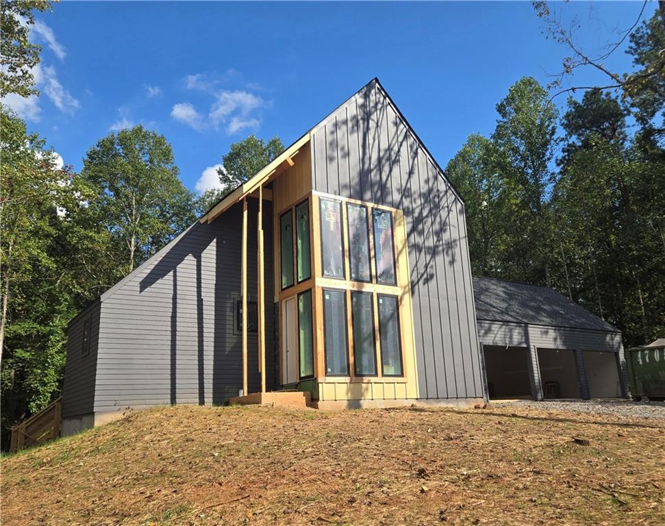 4,142 Finished Sq Ft Next Level Modern Home with Amazing Curb Appeal on 1.3 Acre Homesite. We are Sheetrocked and about to Mud, Sand and Paint Finished Basement with Full Bath and one Unfinished Room for Storage. Pricing includes curated design upgrades. Estimated late 4th Quarter 2025 Move in. Guest suite located on the main level with a work from home space. The Vaulted Primary Suite is upstairs with a Large Laundry with Lower Cabinets and 2 other bedrooms with private en suites. This is a perfect homesite for a pool. Large Andersen casement windows offer lots of light that showcase the natural beauty of the trees and surroundings. The architectural details on the exterior and interior of this home have been meticulously thought out and planned. A delicate balance of light and dark materials, mixed with warm stained woods and timeless metal finishes, create a traditional feel to the interior, while still being fresh and modern to complement the exterior design of the home. The kitchen features Bell Cabinets with soft close drawers and doors and a 54" smooth plastered chimney hood, and Thermador appliances to include a 48" Range. The pantry has custom shelving. Expand your living outdoors to the 18’ x 12’ rear covered porch off the kitchen with 12' Slider Doors! The family room has casement Andersen windows with amazing views to the outside and boasts a 42" direct vent gas fireplace. The secondary bathrooms are incredible with metal framed mirrors, designer lighting and trim details. Hardwoods are included throughout the home. A finished terrace with full bath completes this home. This home is a Zero Energy Ready Home, Spray Foam Insulation in the Attic envelope of the entire home and exterior walls, 18 Seer HVAC and Tankless Water Heater. Aster features an amenity area with fire pit, activity lawn, unstructured play area and nature trails throughout the community. Roswell is Named One of the Top Three Cities in the Nation to Raise Your Family, released by Frommer's. USE 845 COX ROAD ROSWELL as GPS