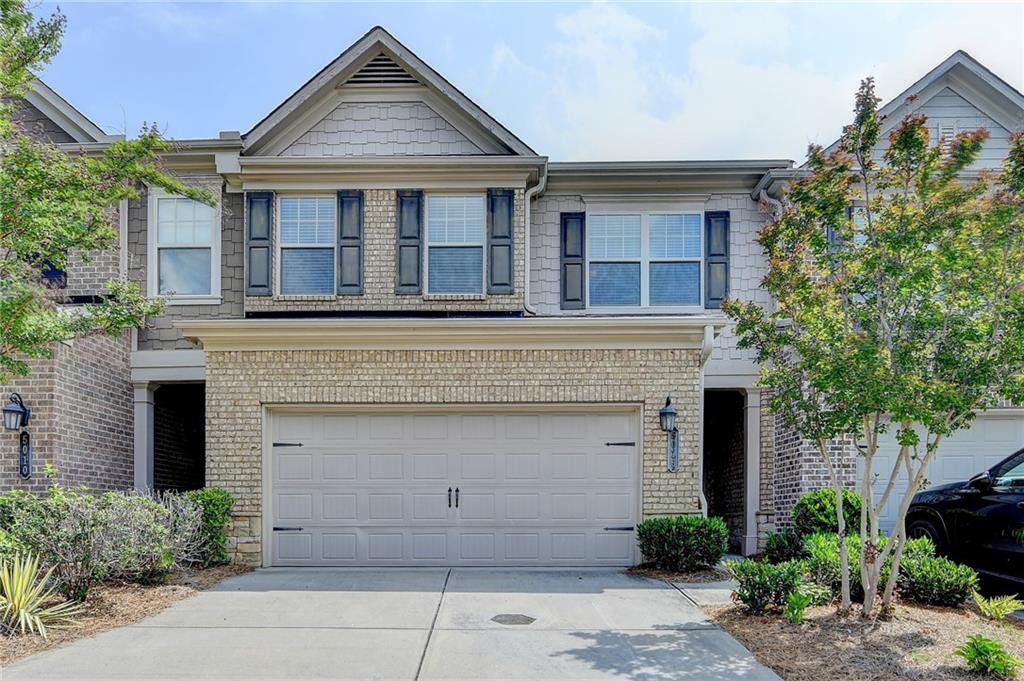 Located in the highly sought-after Johns Creek area, this beautifully maintained 3-bedroom townhome with a spacious loft offers the perfect combination of style, comfort, and convenience. Nestled in a quiet cul-de-sac within a gated community, this home features an open-concept layout that’s ideal for entertaining.You will love the charming curb appeal with its brick façade, cedar shake accents, covered front entry, and two-car garage. Inside, hardwood floors, crown molding, and a seamless flow from the dining area to the family room with a cozy gas fireplace create a warm and welcoming atmosphere.The kitchen boasts a center island, granite countertops, stainless steel appliances, a basket weave tile backsplash, and ample prep space, perfect for hosting or everyday living. A half bath completes the main level. Upstairs, the stylish wrought iron staircase leads to a versatile loft, great for a home office, playroom, or lounge area. The primary suite features a tray ceiling, dual vanities, a soaking tub, a walk-in shower, and a generous closet. Two secondary bedrooms, a full bath, and a convenient upstairs laundry room add to the home's thoughtful layout. Relax outdoors on your private patio, enhanced with a wooden privacy partition. Additional features include two Nest thermostats, an irrigation system, and community-maintained exterior and landscaping, allowing for true low-maintenance living. Situated in one of North Metro Atlanta’s premier locations with access to award winning, top-rated schools, parks, shopping, dining, and more — this is one you don’t want to miss. Showings begin Saturday, 6/7!