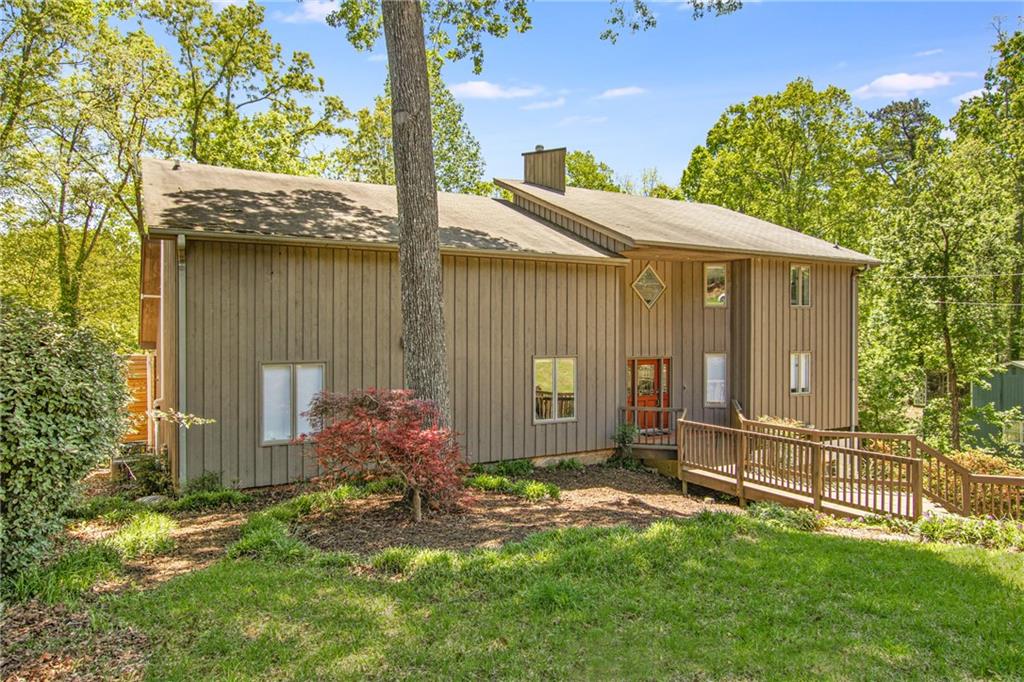 Are you looking for a modern, meticulously renovated home on south Lake Lanier? This home fits that bill & so much more. All the fixtures & finishes are right on point w/ the latest trends, plus dozens of other distinctive features. It’s a short path to the almost-new MacDaddy double-slip party dock on great water which you can see from the house. Priced BELOW APPRAISAL, you’ll love the outdoor spaces including the fire pit, massive decks, huge patio & more. Upstairs, there’s a versatile lofted floor w/ a living/tv room, reading nook, office & an extra room for visitors (would make a great bunk room). The terrace level looks right out of a design magazine including a huge fireplace, mini bar, built-in bar table, tv nook, wide open space (dance floor?) plus so much more. Three laundry hookups, so you can choose the most convenient. Definitely not a cookie-cutter house, you’ll love the energy of this lakefront home & the unbeatable location close to everything by land and water.