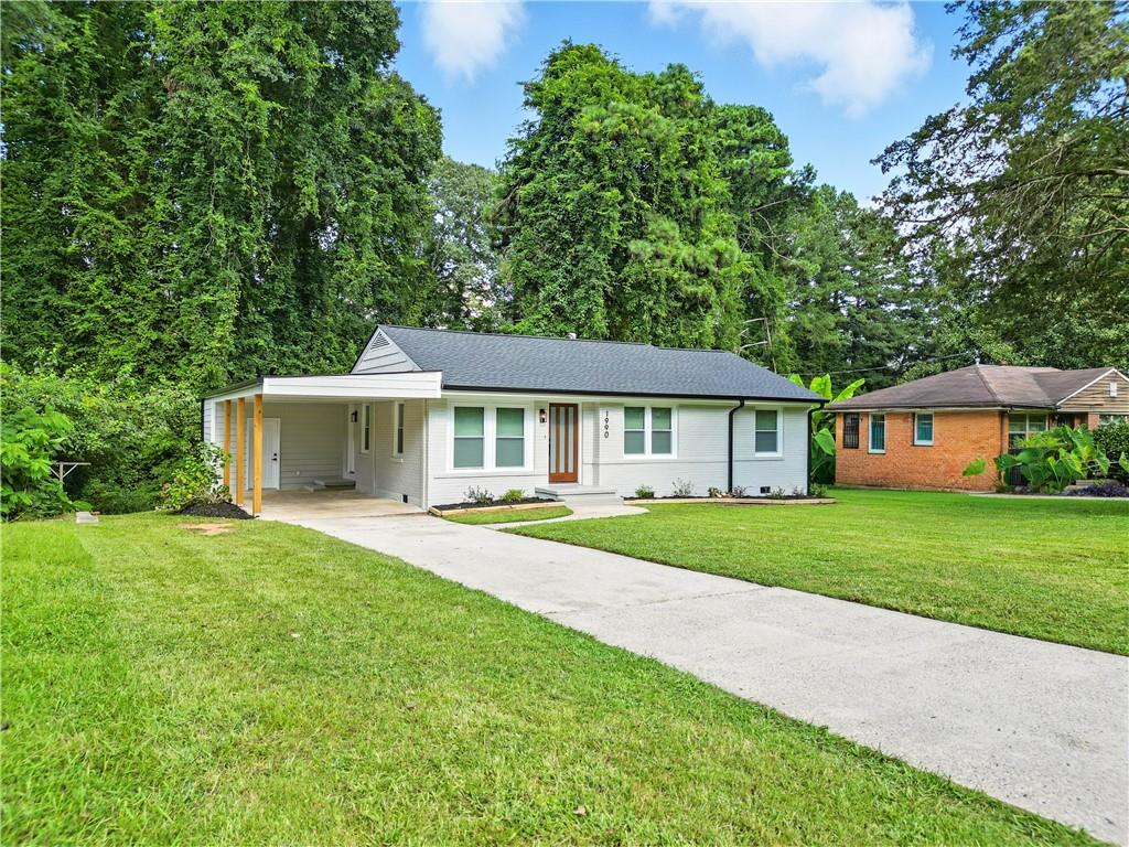 This stunning fully remodeled home offers the perfect blend of modern style, comfort, and peace of mind, with no detail overlooked from the bottom up to the roof. The property has been freshly painted inside and out and features a brand new roof, new insulated attic, gutters, air ducts, and A/C system, ensuring efficiency and durability for years to come. Built with the timeless strength of four sided brick, the home has also been updated with new windows, new doors, and a termite bond already in place, giving you extra confidence in your investment. Step inside to find a beautifully staged interior that feels fresh, inviting, and move in ready. The new flooring runs seamlessly throughout the home, complemented by recessed lighting, modern fixtures, new baseboards, and trim that highlight the clean design. All major systems, including plumbing and electric, have been completely replaced, along with new Sheetrock, making this property practically brand new on the inside. The heart of the home is the kitchen, which has been fully renovated with quartz countertops, sleek stainless steel appliances, stylish new cabinets, and a crisp white backsplash that ties the space together. The bathrooms have also been completely remodeled, featuring quartz countertops, new vanities, ceramic tiled showers and tubs, and updated lighting that creates a spa like atmosphere. With three spacious bedrooms and two full bathrooms, this home provides plenty of space for comfort. The master suite includes a large walk in closet and a beautifully updated bathroom designed with modern finishes. Every room offers generous closet space, making it both practical and stylish. Outside, enjoy a new back deck overlooking a good sized backyard that's perfect for relaxing or entertaining, with additional storage available for your convenience. The property also offers a carport and a welcoming front yard, giving it excellent curb appeal. Located in a very quiet neighborhood yet still in a centric area close to your favorite restaurants, shops, and stores, this home truly combines convenience with tranquility. With all new systems, finishes, and upgrades, you won't have to worry about maintenance or repairs for years to come. Feel free to bring your inspector and see for yourself the quality of this complete renovation. Don't hesitate to come check it out! You'll fall in love the moment you walk in.