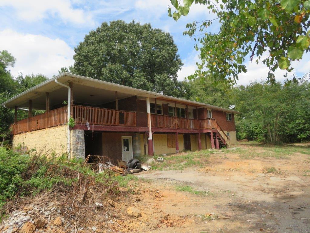 Great opportunity for a 1 acre lot in Powder Springs! Spacious living room and separate dining room! Kitchen includes additional breakfast area! Three spacious bedrooms and two full bathrooms! Basement includes second kitchen, living room, bedroom and bathroom! Large covered deck and wrap around covered porch! Ready to make this your dream home! Submit an offer today!
