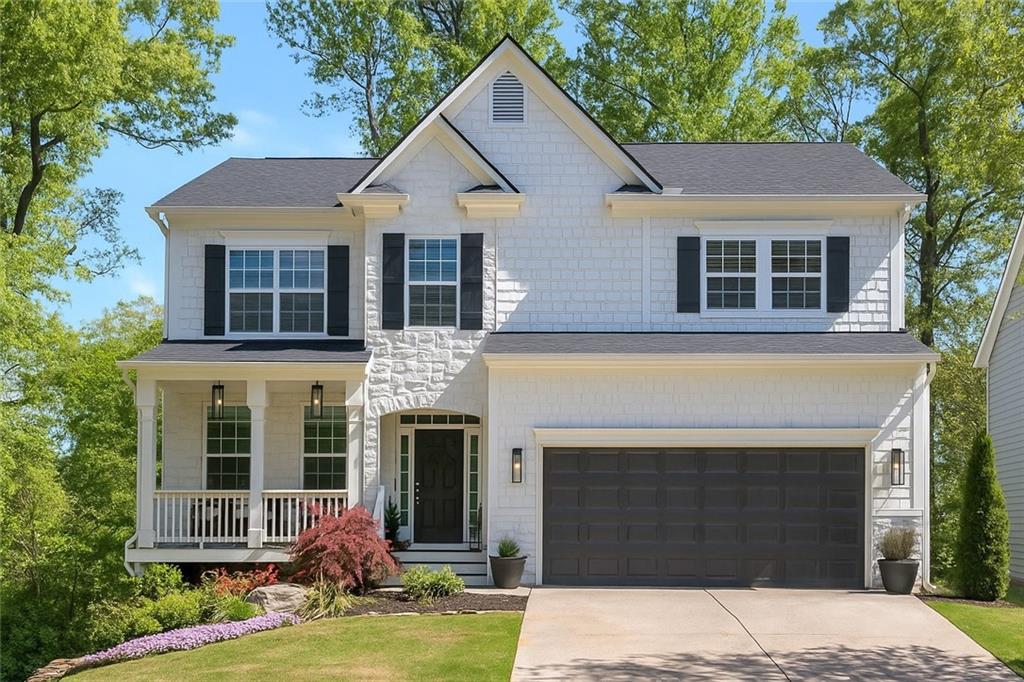 Welcome to your dream home in the sought-after Wild Meadows community! Nearly every inch of this beautiful North-facing property has been thoughtfully updated, offering the perfect blend of modern finishes and functional space.
Step into the heart of the home—this fully updated kitchen is a true showstopper. Classic white shaker cabinets with pull-out shelves provide smart, functional storage, while bold black stainless steel appliances—including a sleek microwave drawer—add a striking modern edge. Elegant quartz countertops pair beautifully with a German schmeared brick backsplash and a custom vent hood, adding both character and craftsmanship. Warm floating wood shelves complete the curated design, blending style and function.
The open-concept layout features rich wood floors throughout, seamlessly connecting the kitchen to a spacious family room with a stone gas fireplace—perfect for entertaining or relaxing evenings. A versatile front room adds flexibility to the floorplan, ideal for a home office, playroom, or study.
Upstairs, you’ll find four generous bedrooms, including an oversized primary suite with a tranquil sitting area. The fully renovated primary bathroom boasts dual vanities with quartz countertops, a large frameless rain shower, large cumstomized closet and thoughtful upgrades throughout.
Enjoy the outdoors from your screened-in back porch—perfect for gatherings in the privacy of your fenced backyard. The backyard has been beautifully refreshed with brand-new sod and new landscaping, creating a lush and inviting outdoor space. Updated lighting—inside and out—adds even more charm and curb appeal. Nestled on a private lot with no neighbors to the left or across the street, this home offers a rare blend of seclusion, serenity, and comfort.
Need space for hobbies or storage? The full walkout basement offers 1,420 square feet of potential, already stubbed for a bathroom and ready for you to finish to your needs. It includes abundant organized storage and a dedicated woodworking shop with a 220V line, workbench, and pegboard—ideal for handymen, DIYers, or tinkerers. You'll also find a spacious semi-finished room, perfect as a kids' playroom, home gym, or casual hangout space for adults.
Located just a short walk to the community pool, tennis courts, playground, and basketball court, this home offers unbeatable lifestyle and convenience. You’re just minutes from GA 400, the North Georgia Premium Outlets, Lake Lanier, top-rated schools, restaurants, beautiful local parks , AND the new Coal Mountain Town Center development!
Don’t miss your chance to own this exceptional home!
